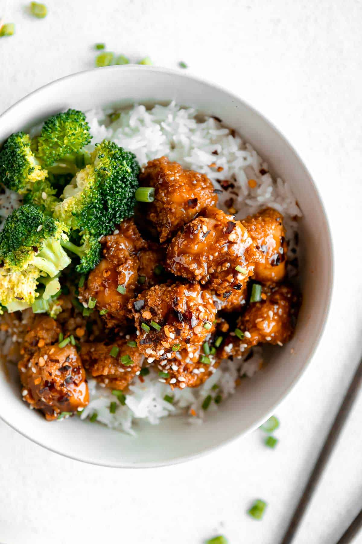 overhead shot of the orange chicken with broccoli and rice