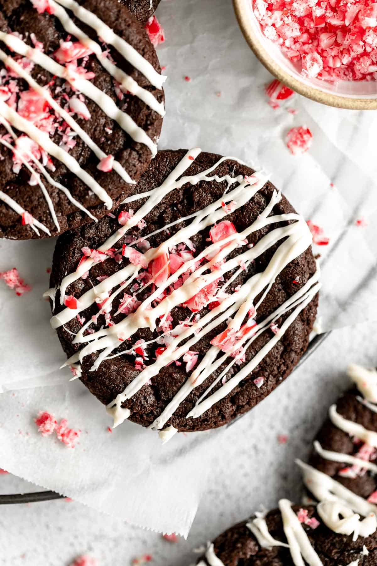 gluten free chocolate peppermint cookies with candy canes and white chocolate on top