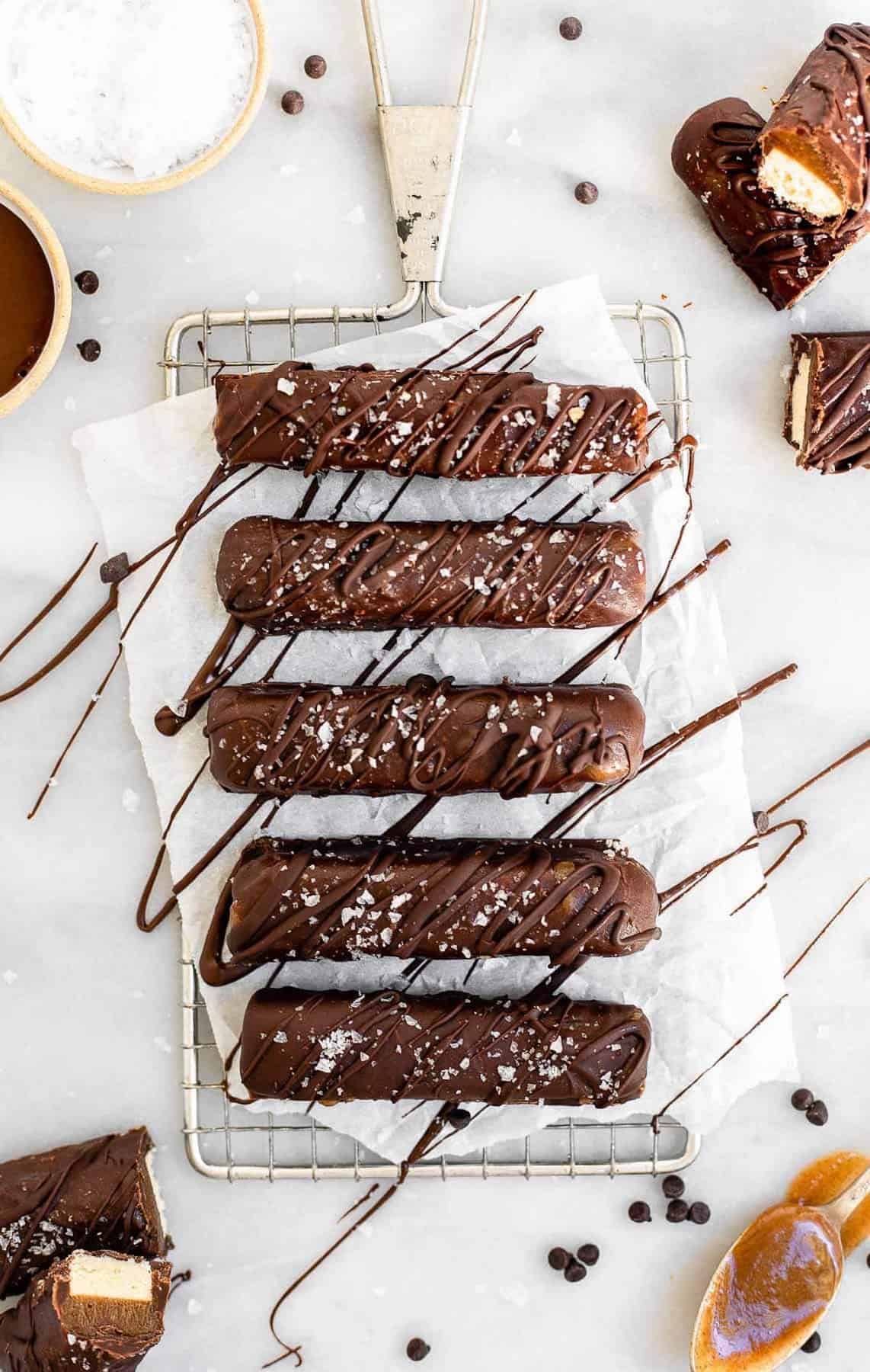 Final twix bars with chocolate drizzled on top.