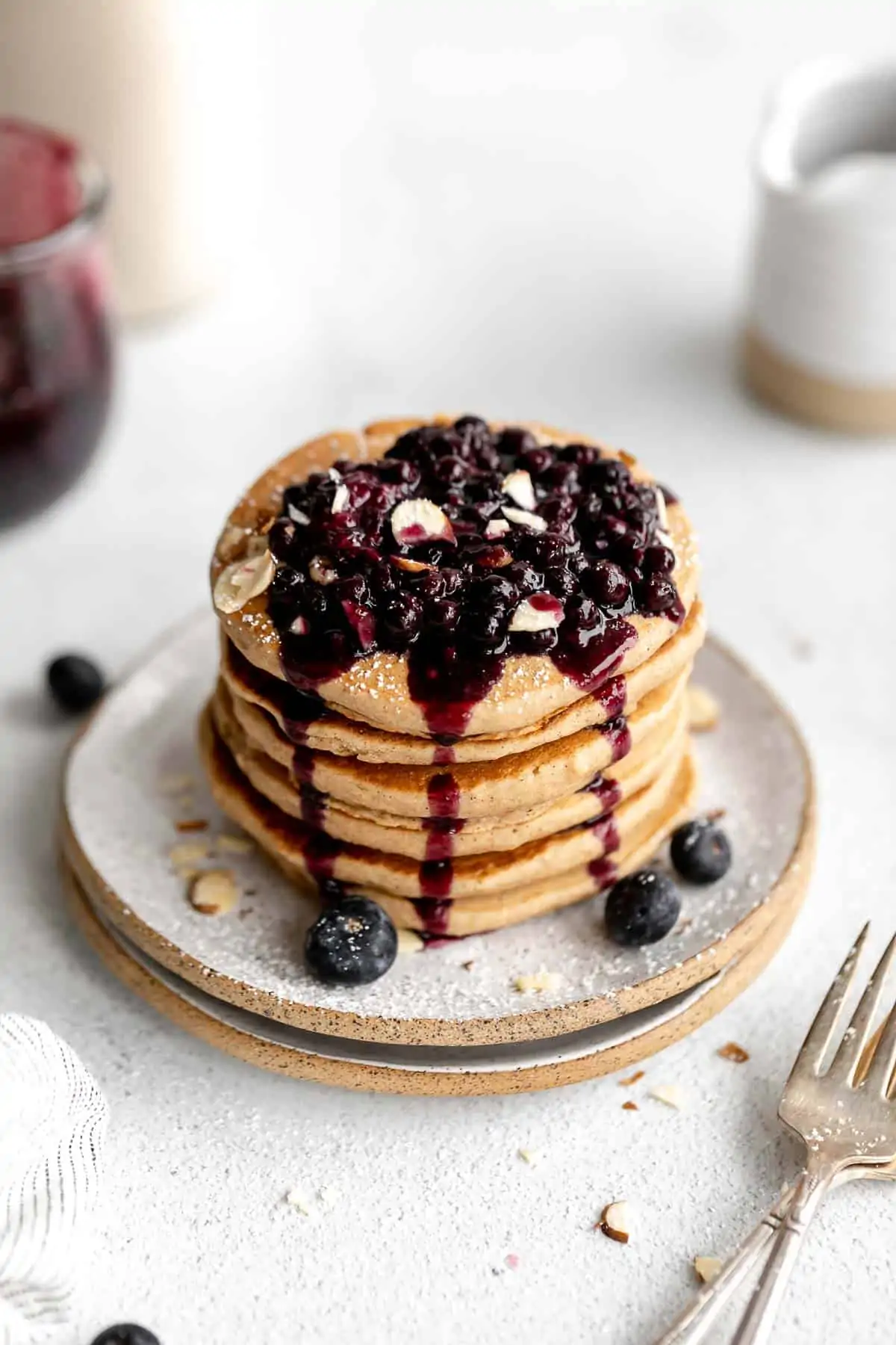 vegan gluten free pancakes on a plate with blueberries