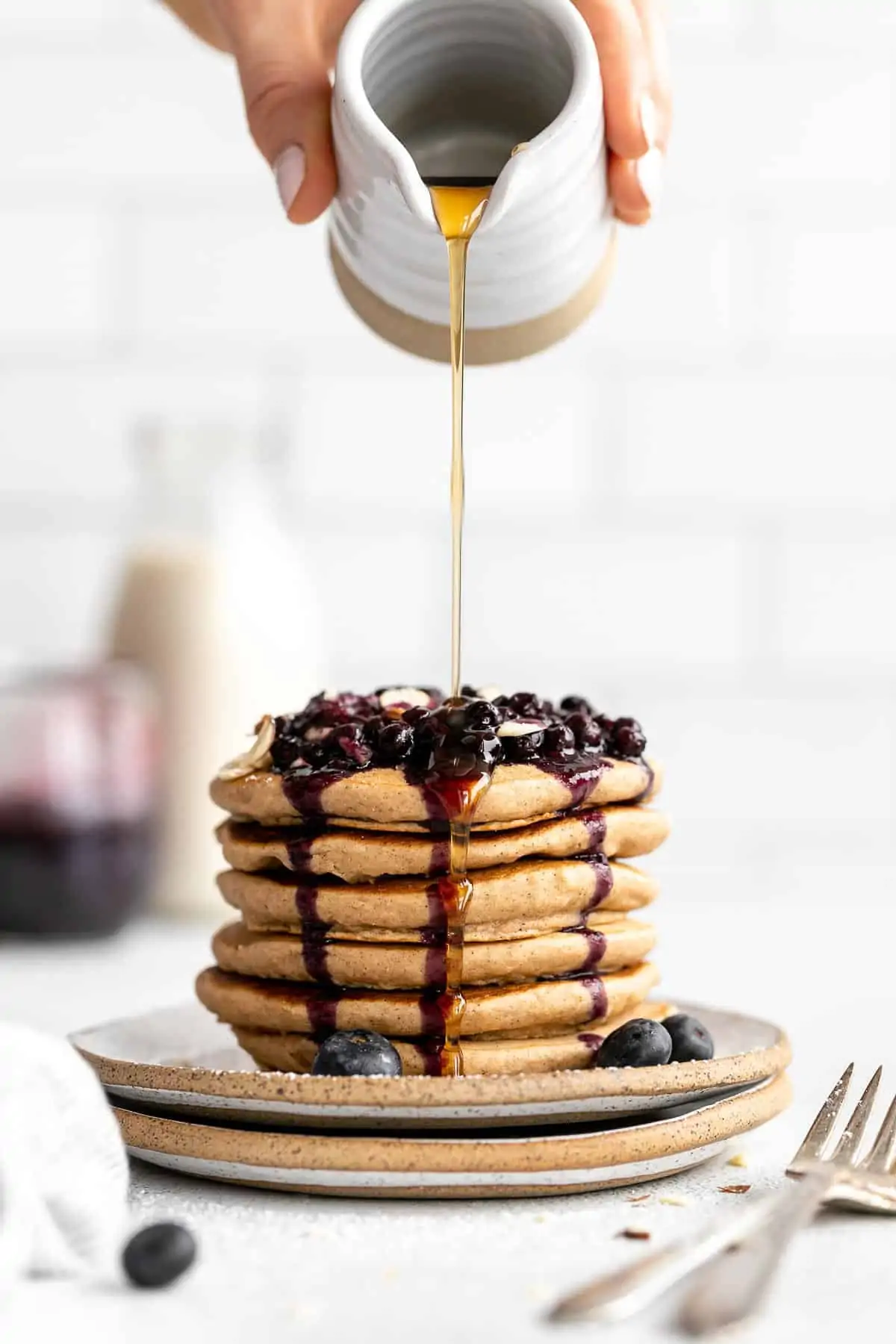 stack of vegan gluten free pancakes with blueberry compote