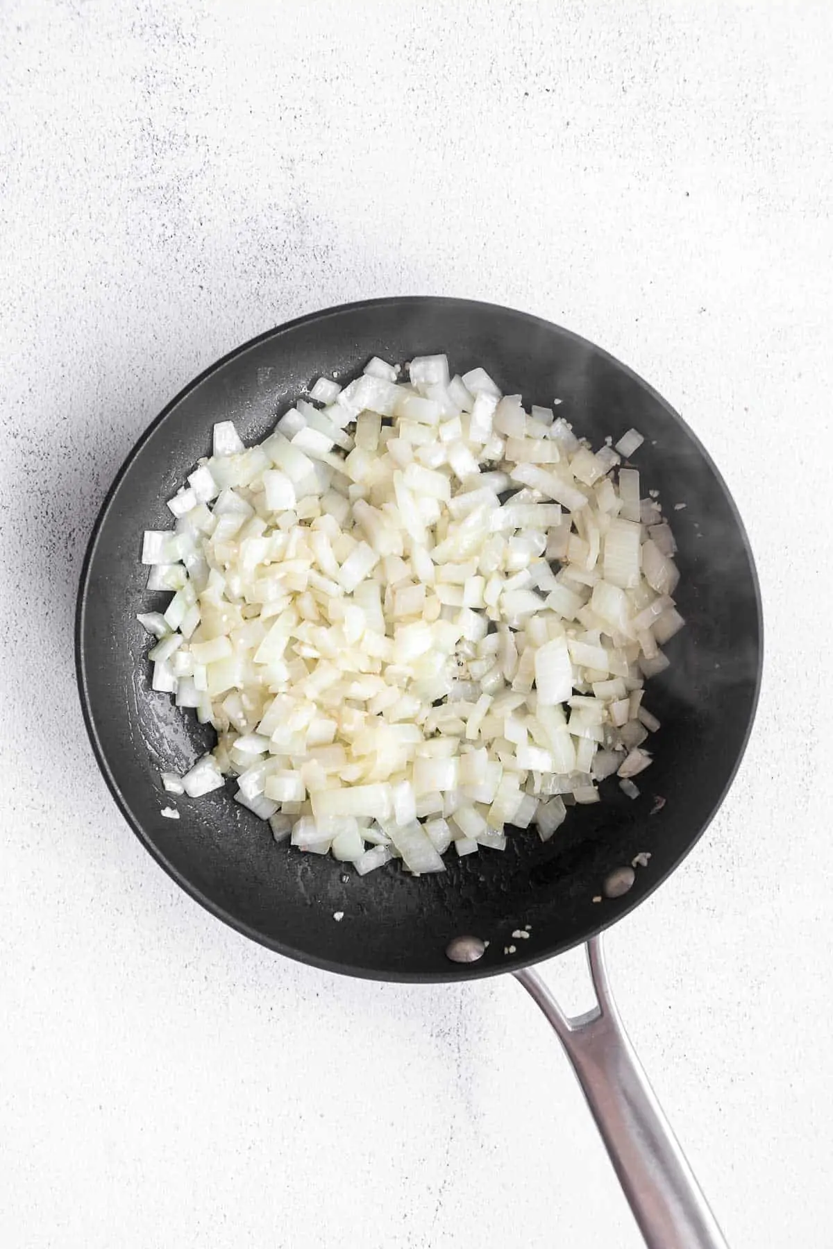 diced onion in a pan