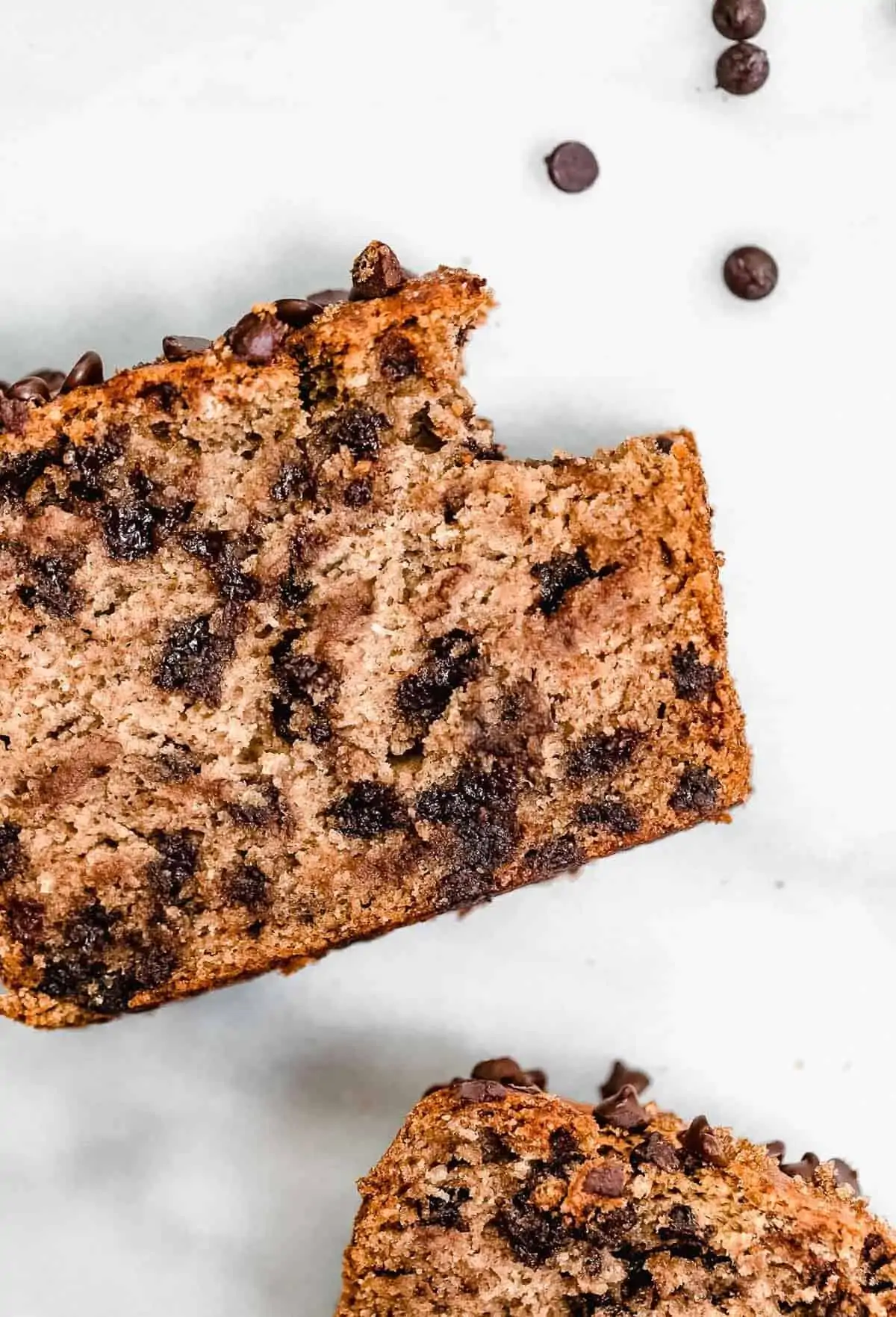 Chocolate chip banana bread with one bite taken out. 