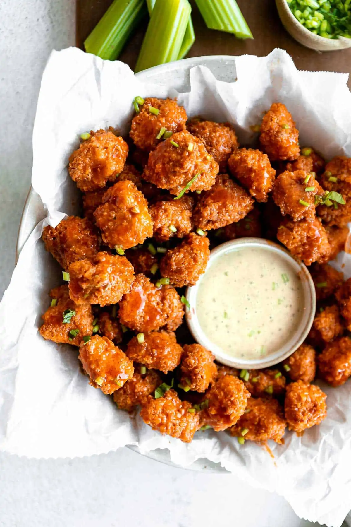gluten free air fryer popcorn chicken with buffalo sauce and ranch