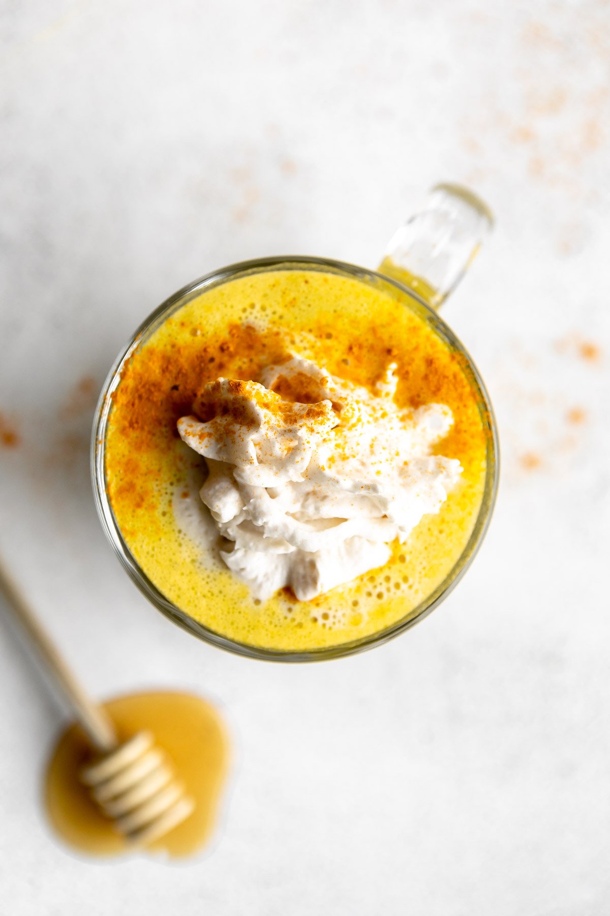 golden milk turmeric latte with whipped cream on top