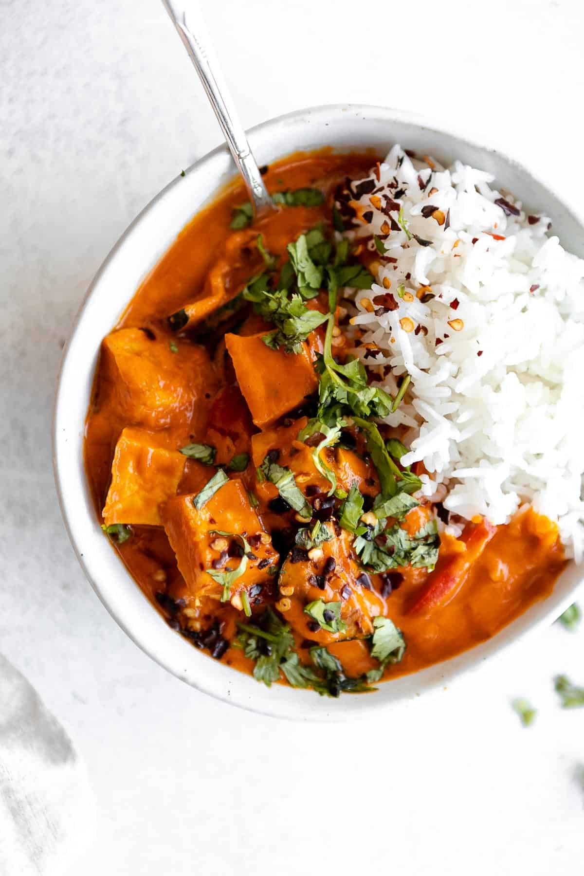 thai red tofu curry in a bowl with white rice
