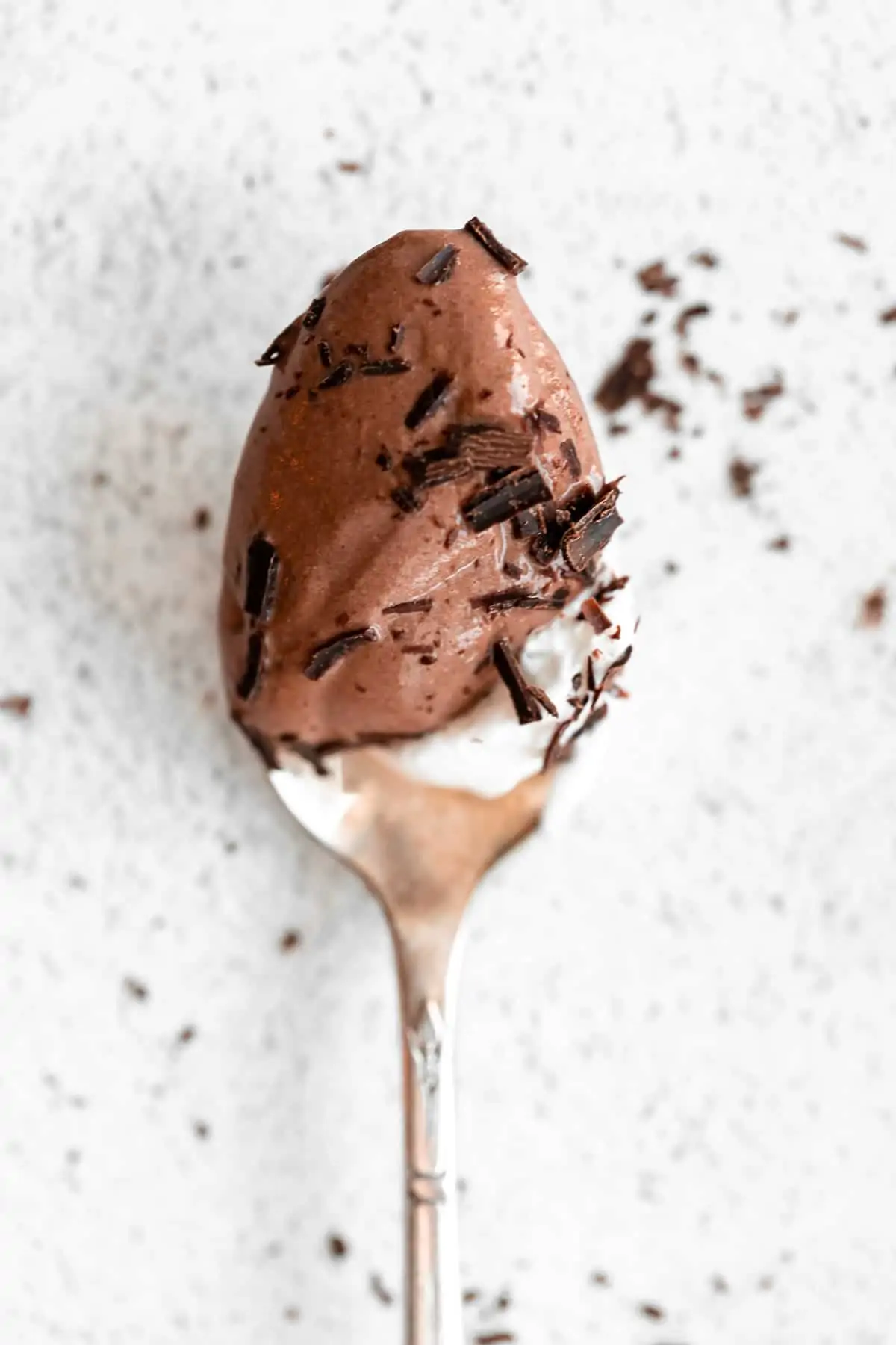 spoon with a bite of the chocolate mousse