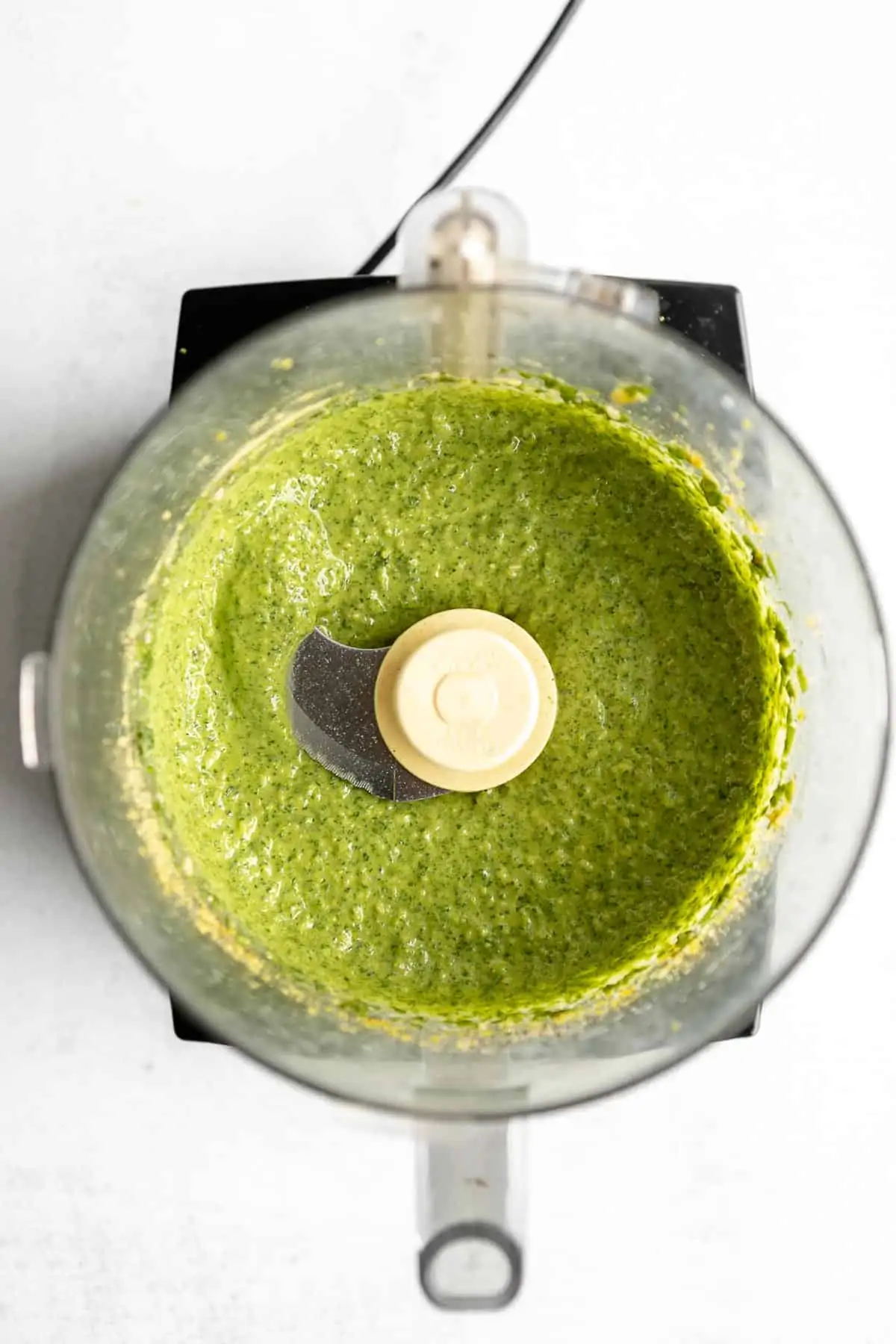 pesto sauce in the food processor after blending