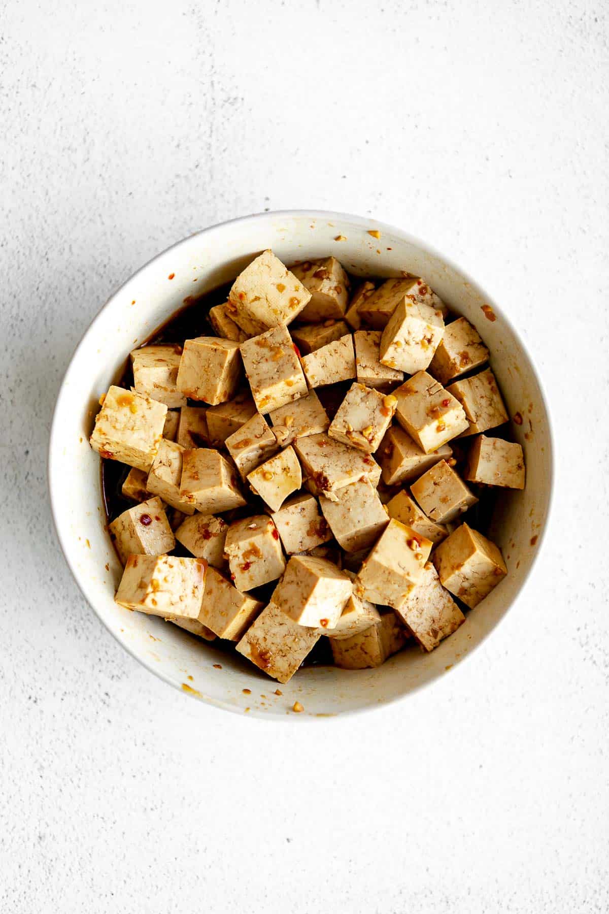tofu marinting in a bowl