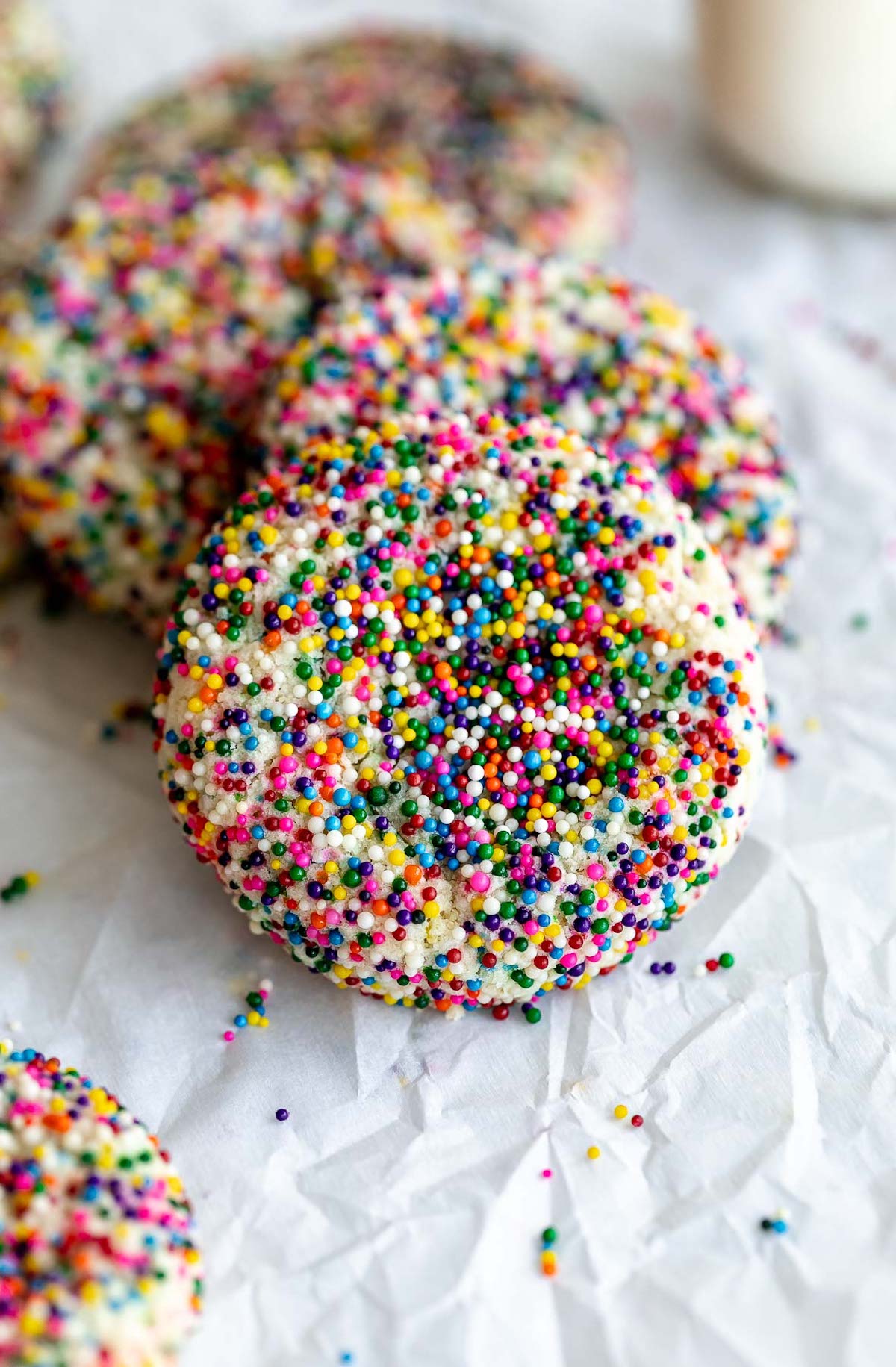 funfetti sprinkle cookies on a piece of parchment paper