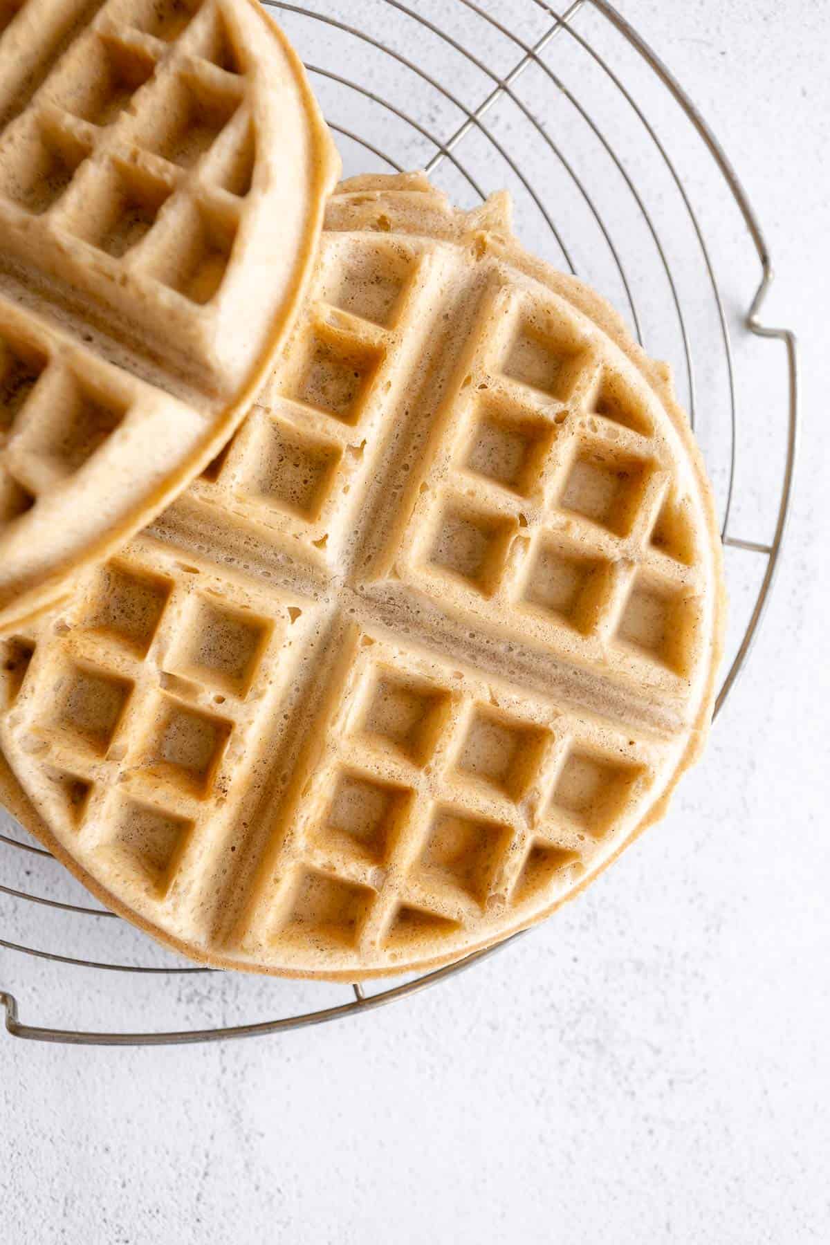 gluten free waffles on a cooling rack after cooking