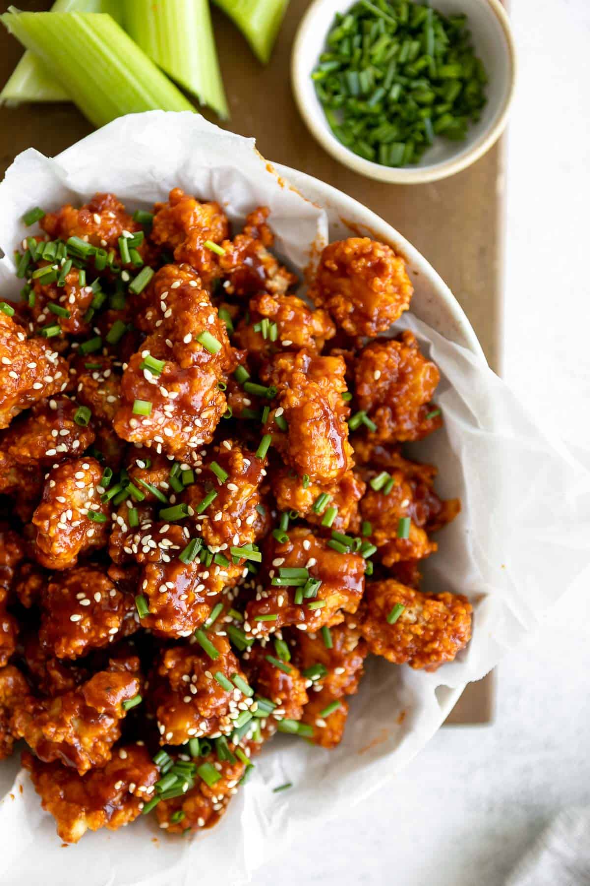 overhead shot of the korean spicy popcorn cauliflower with chopped chives