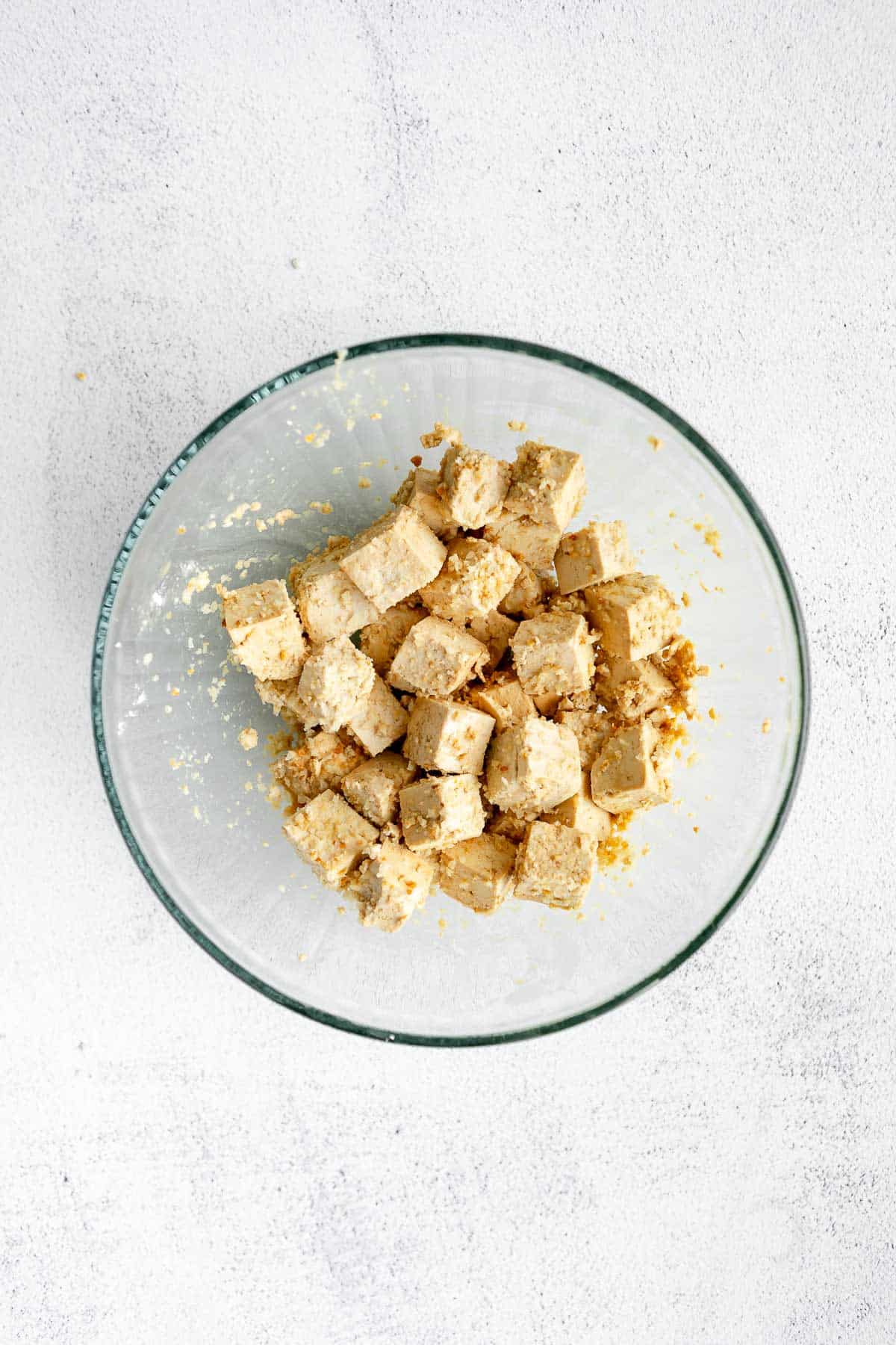 tofu in a bowl before baking
