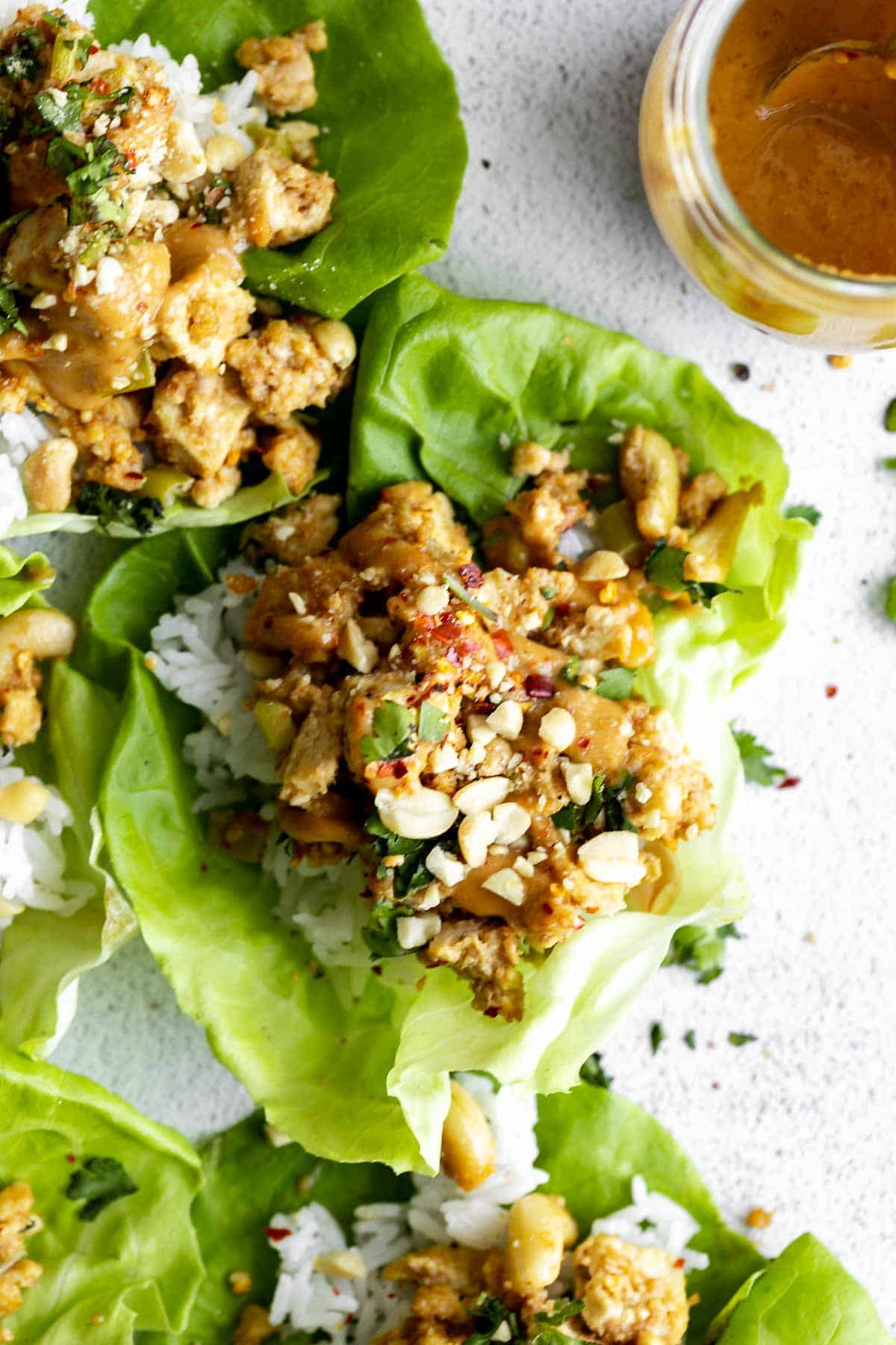 vegan lettuce wraps with peanut sauce on the side