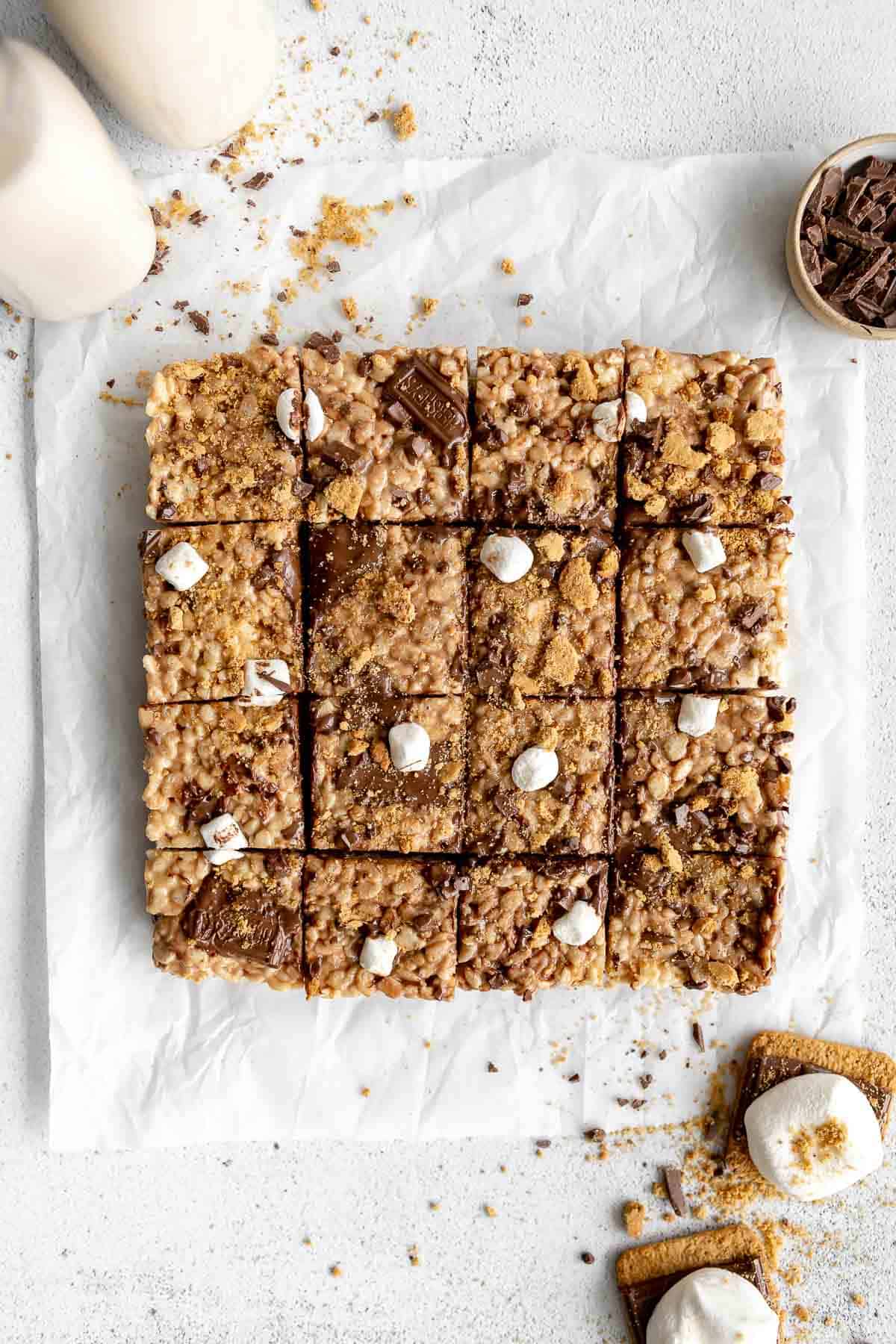 vegan rice krispies on parchment paper with melted chocolate