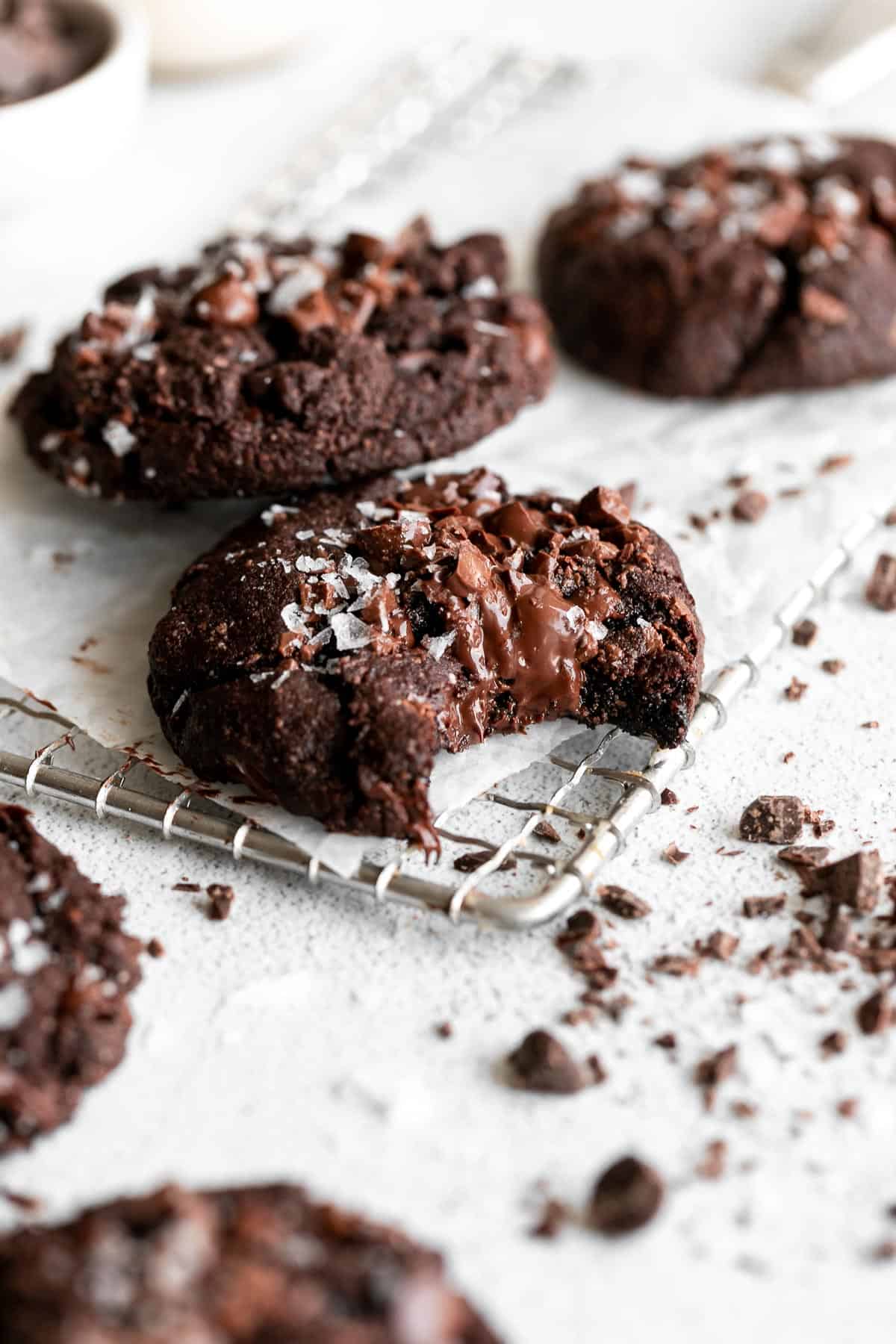 almond flour double chocolate chip cookies with a bite taken out with melted chocolate