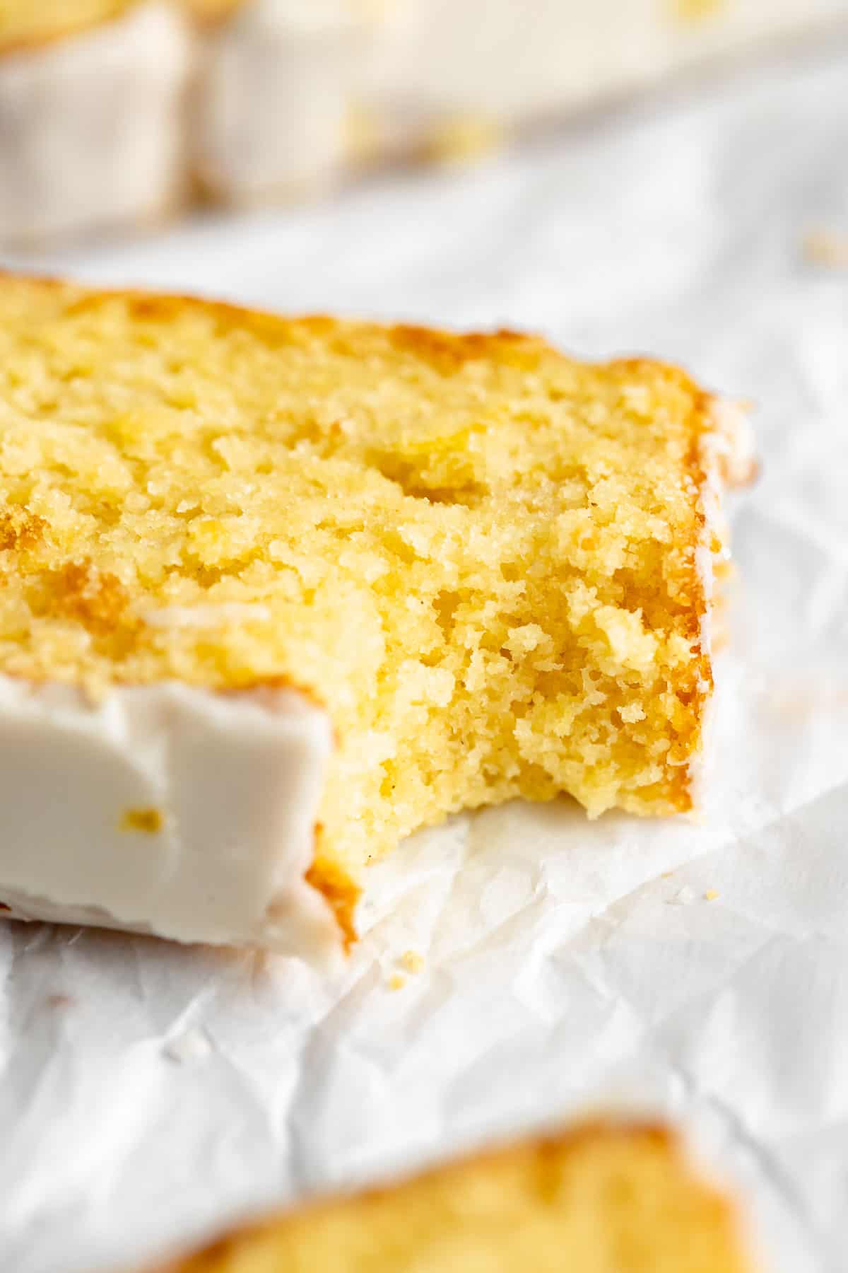 up close image of the lemon cake with a bite taken out to show texture