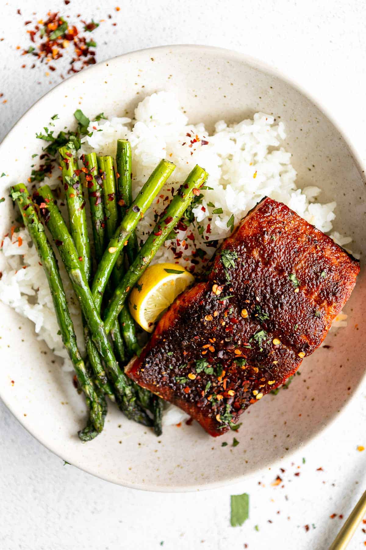 frozen air fryer salmon in a bowl with rice and veggies