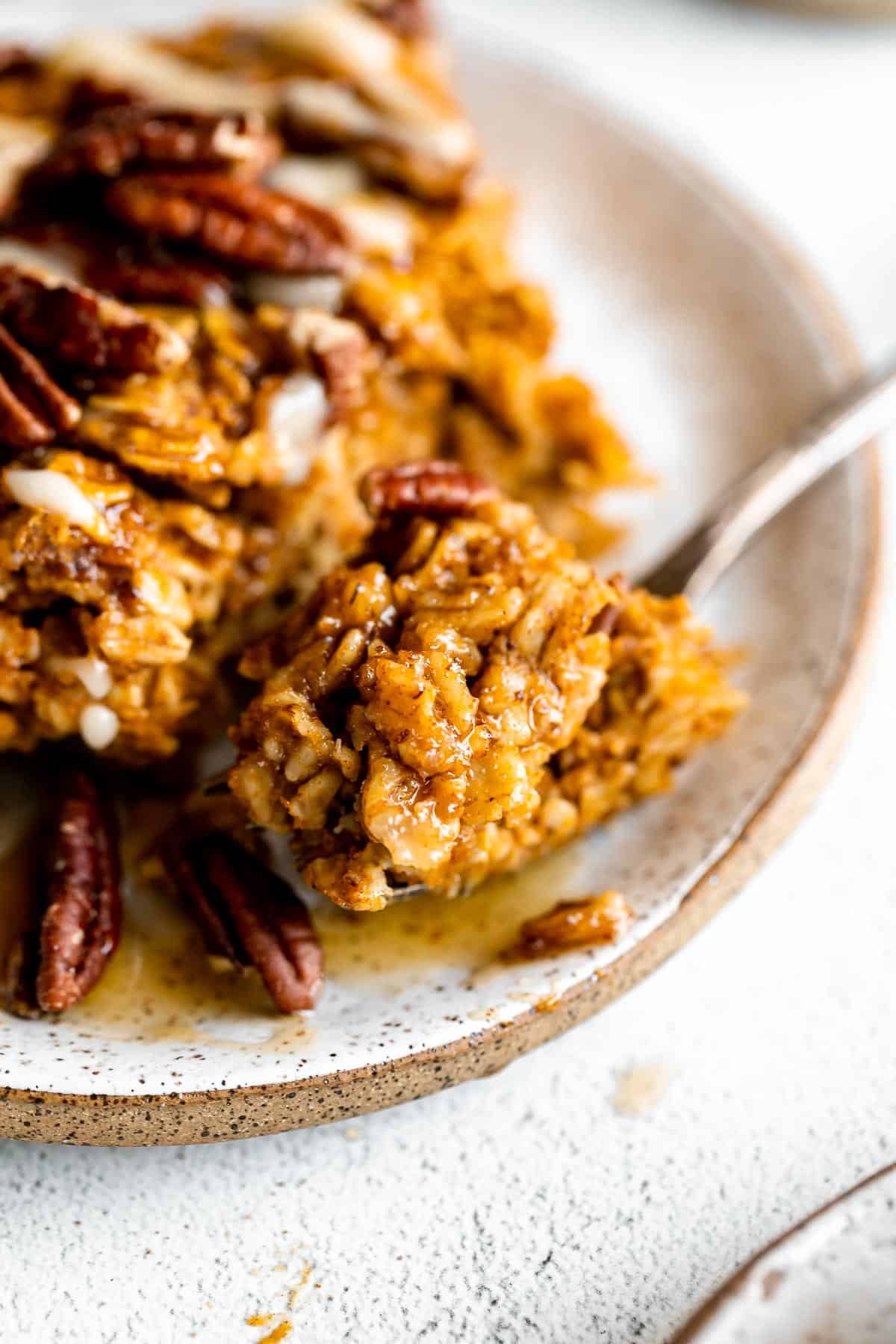 baked pumpkin oatmeal with a bite taken out to show texture