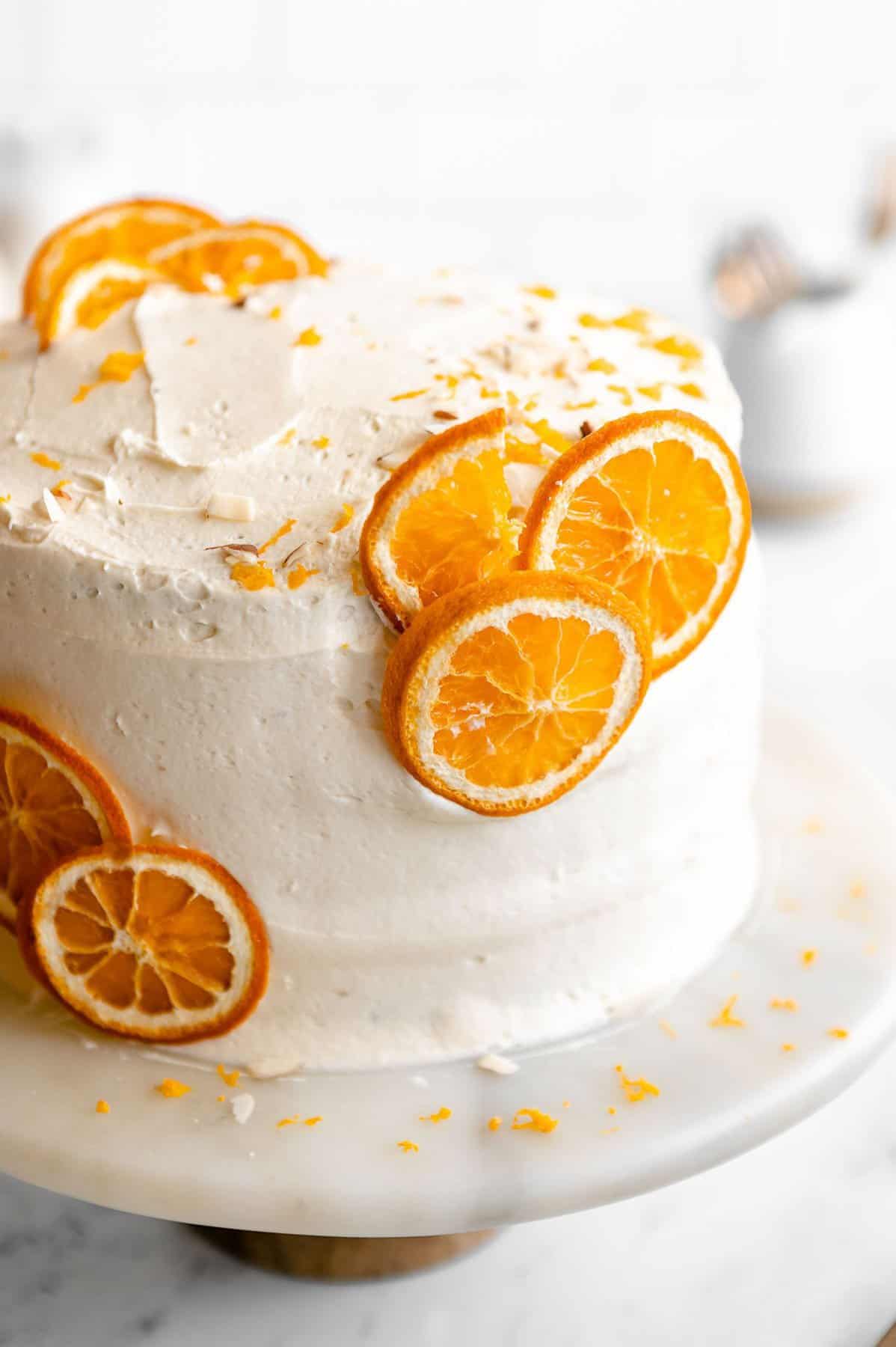 angled view of the cake with fresh orange slices