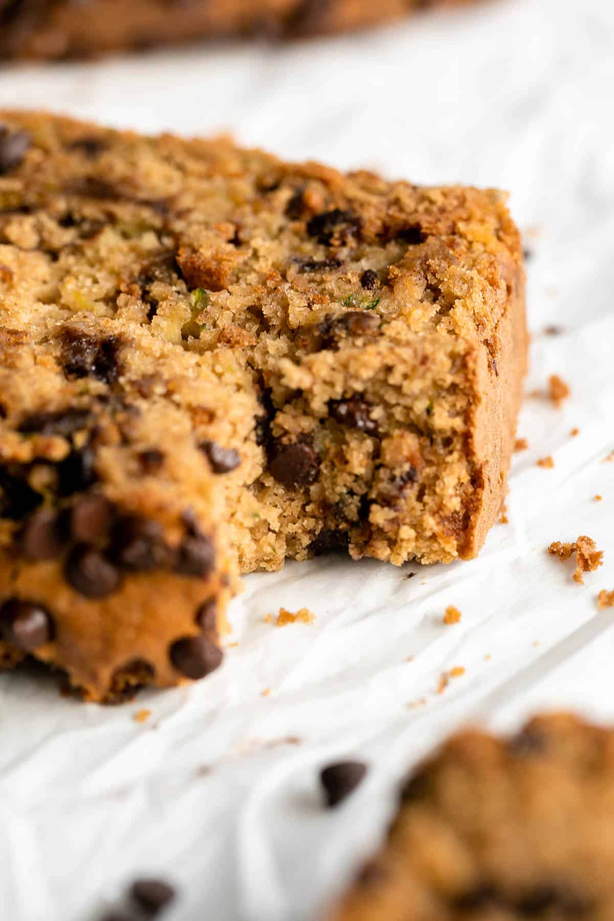 up close image of the gluten free zucchini bread with a bite taken out to show texture