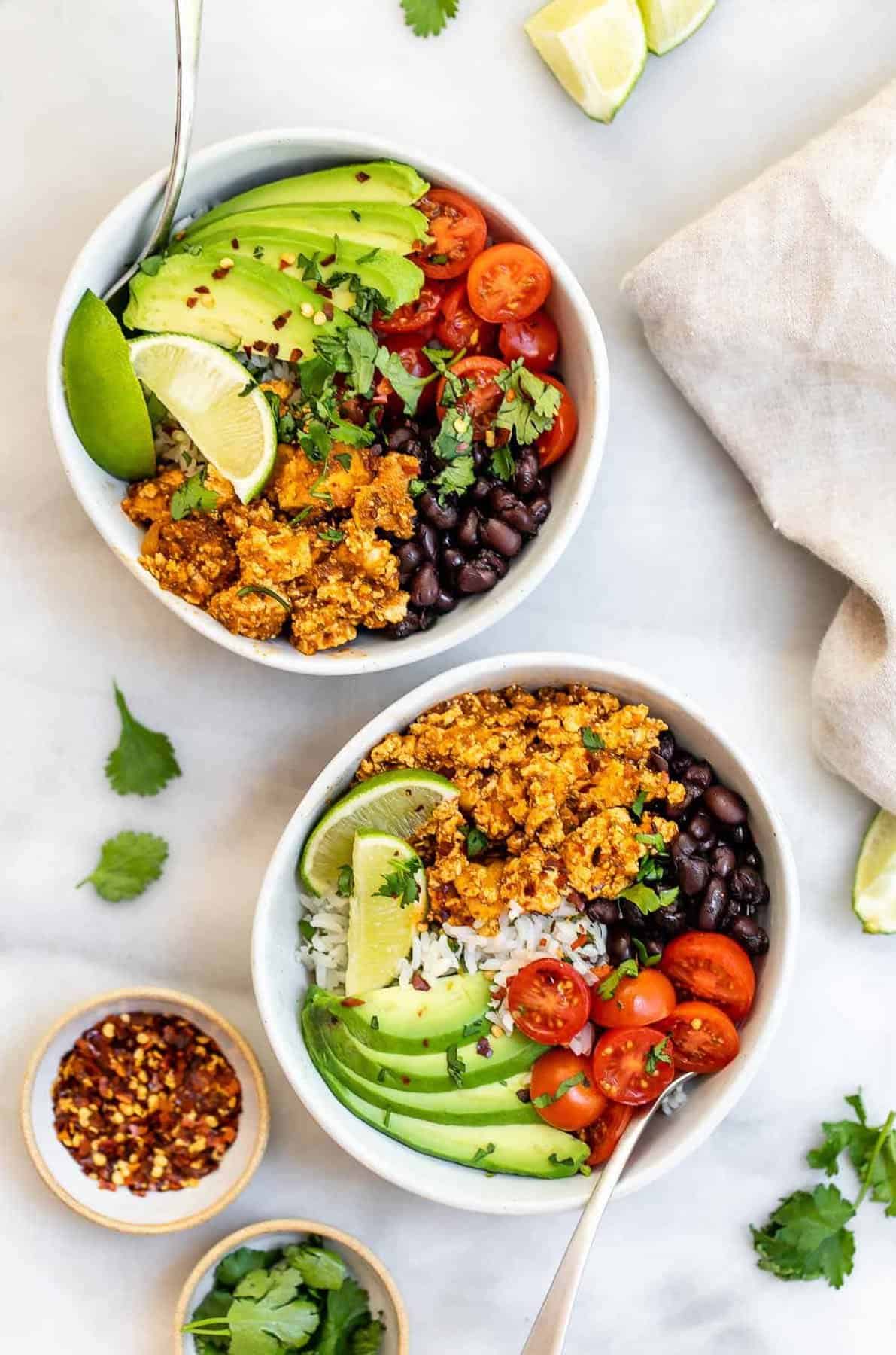 Two bowls with the sofritas recipe with rice, beans and avocado.
