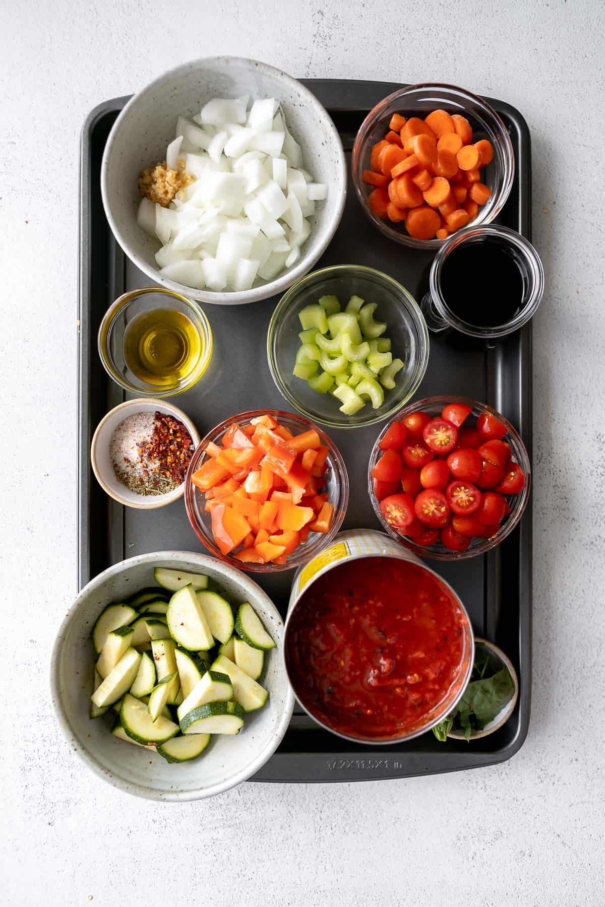 ingredients for the recipe in bowls on a baking sheet