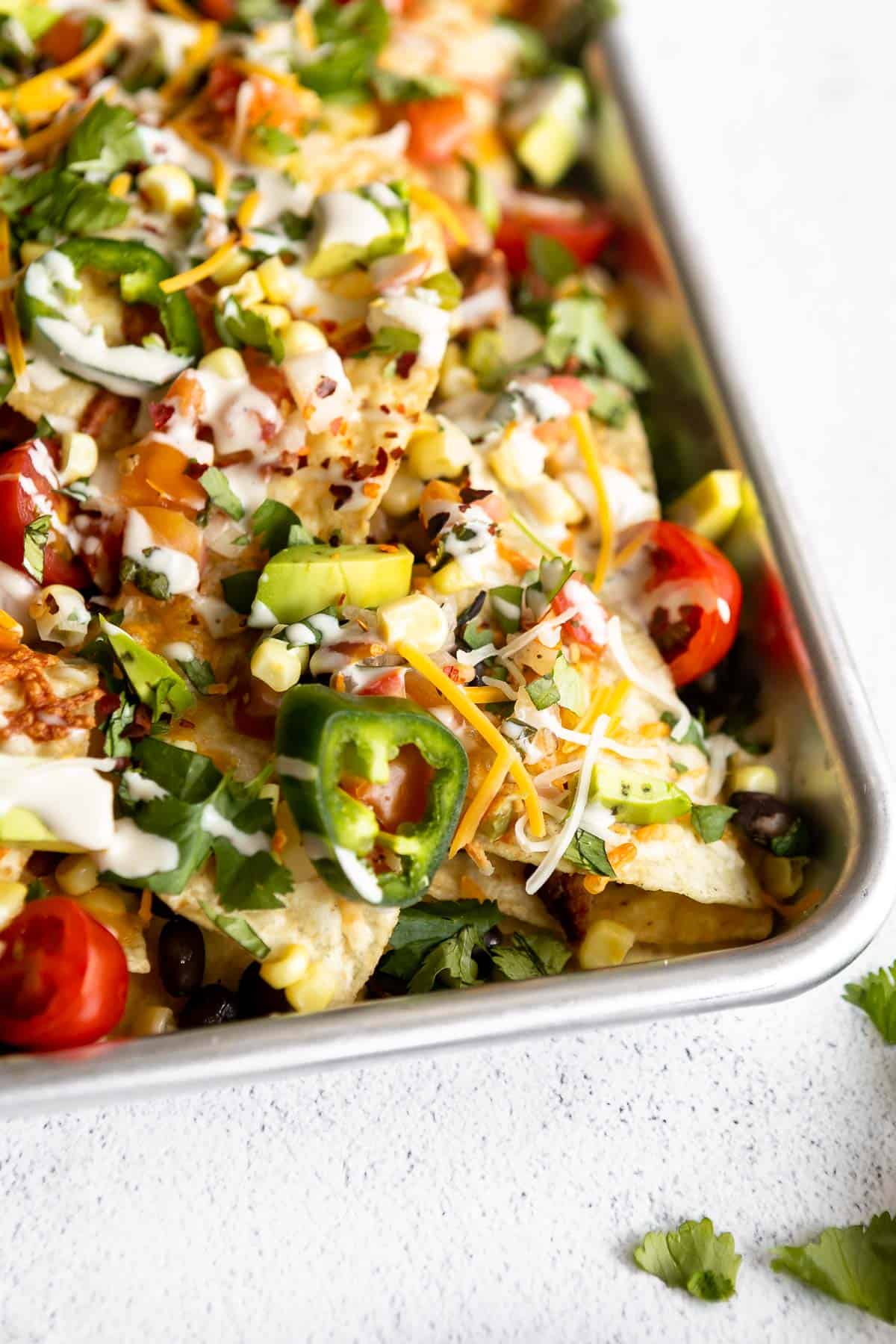 angled view of the loaded nachos with jalapeno