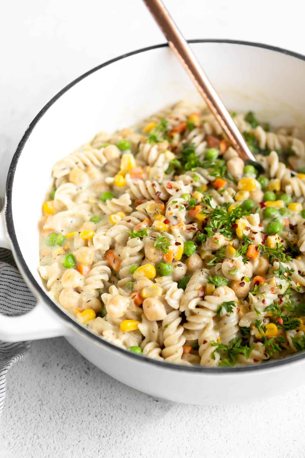 chickpea pot pie pasta recipe in a pot with fresh parsley