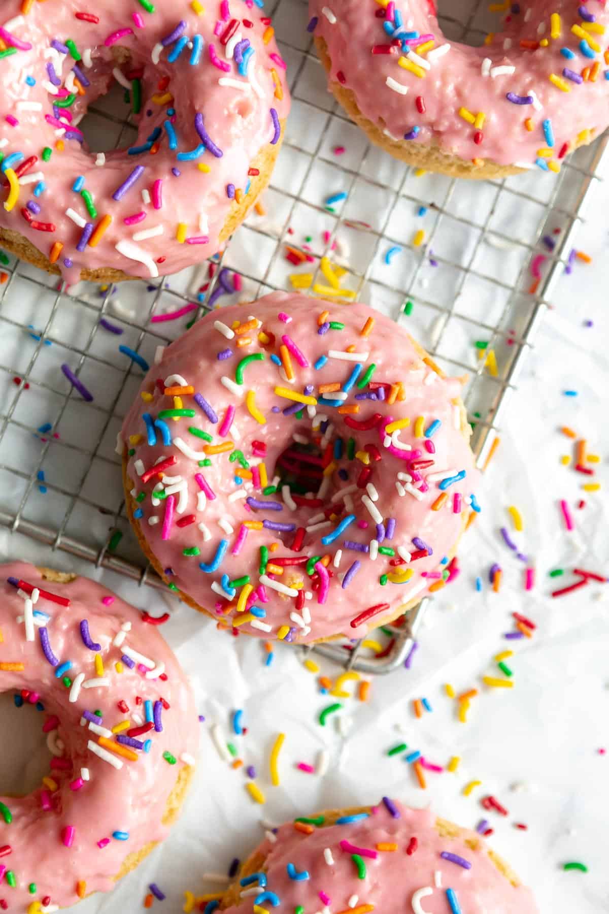 gluten free baked donuts with strawberry glaze and sprinkles on top