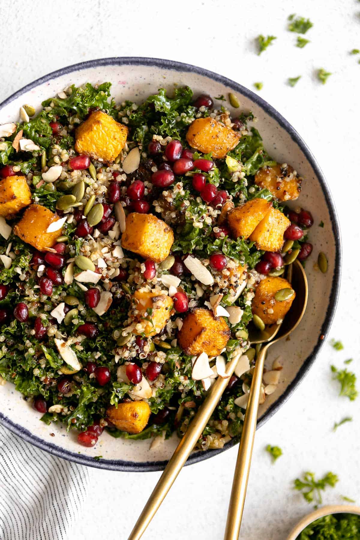 roasted butternut squash salad with quinoa and pumpkin seeds in a bowl