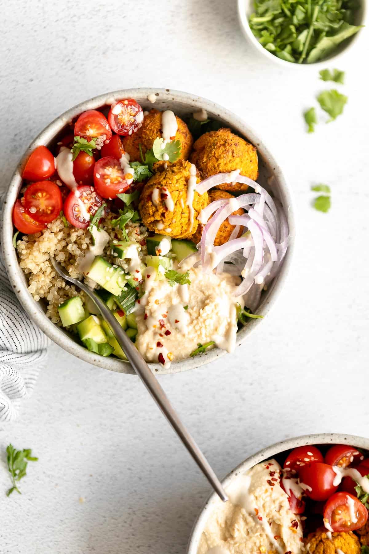 sweet potato falafel bowls with quinoa, tomatoes and cucumber