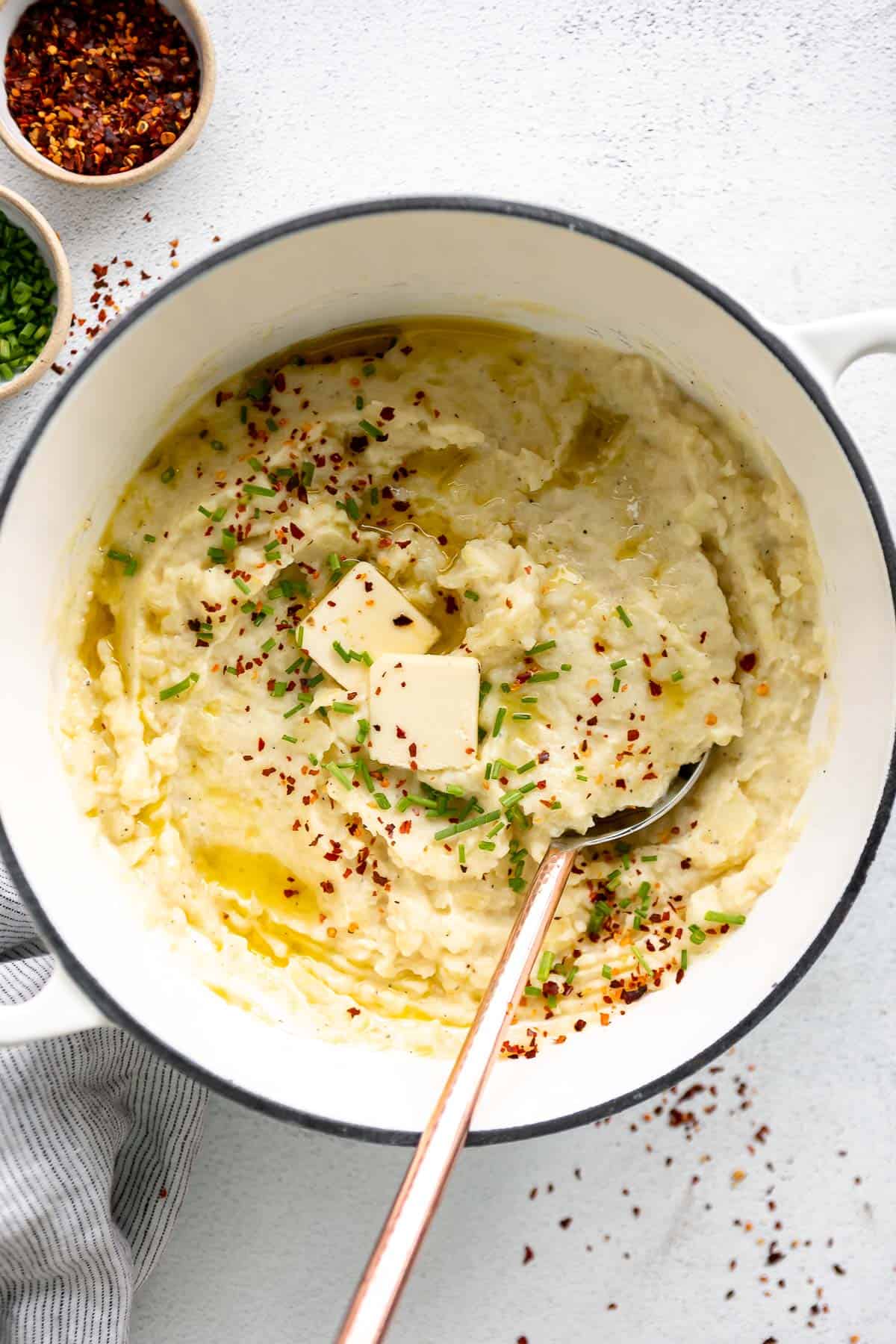 healthy mashed potatoes in a pot with a spoon on the side