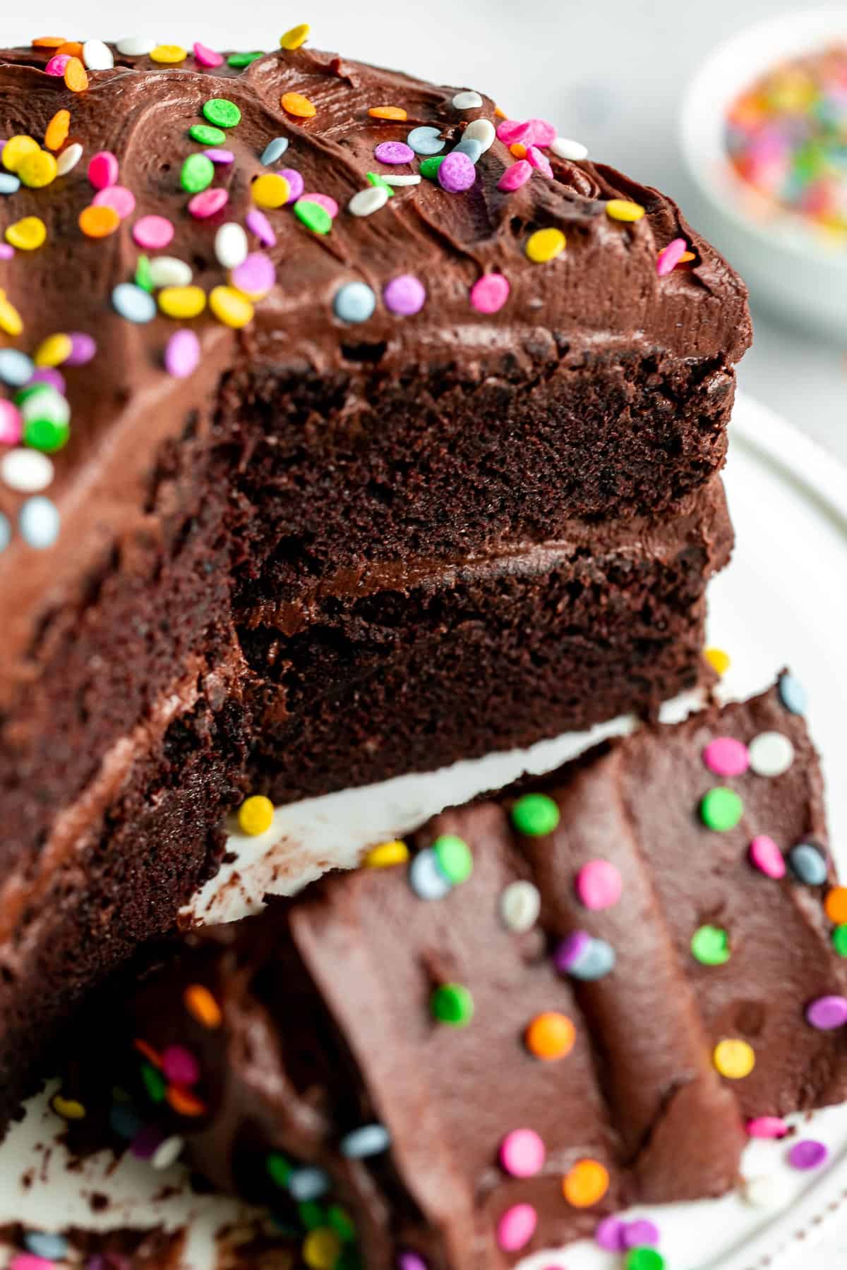 mini chocolate cake sliced on a cake stand