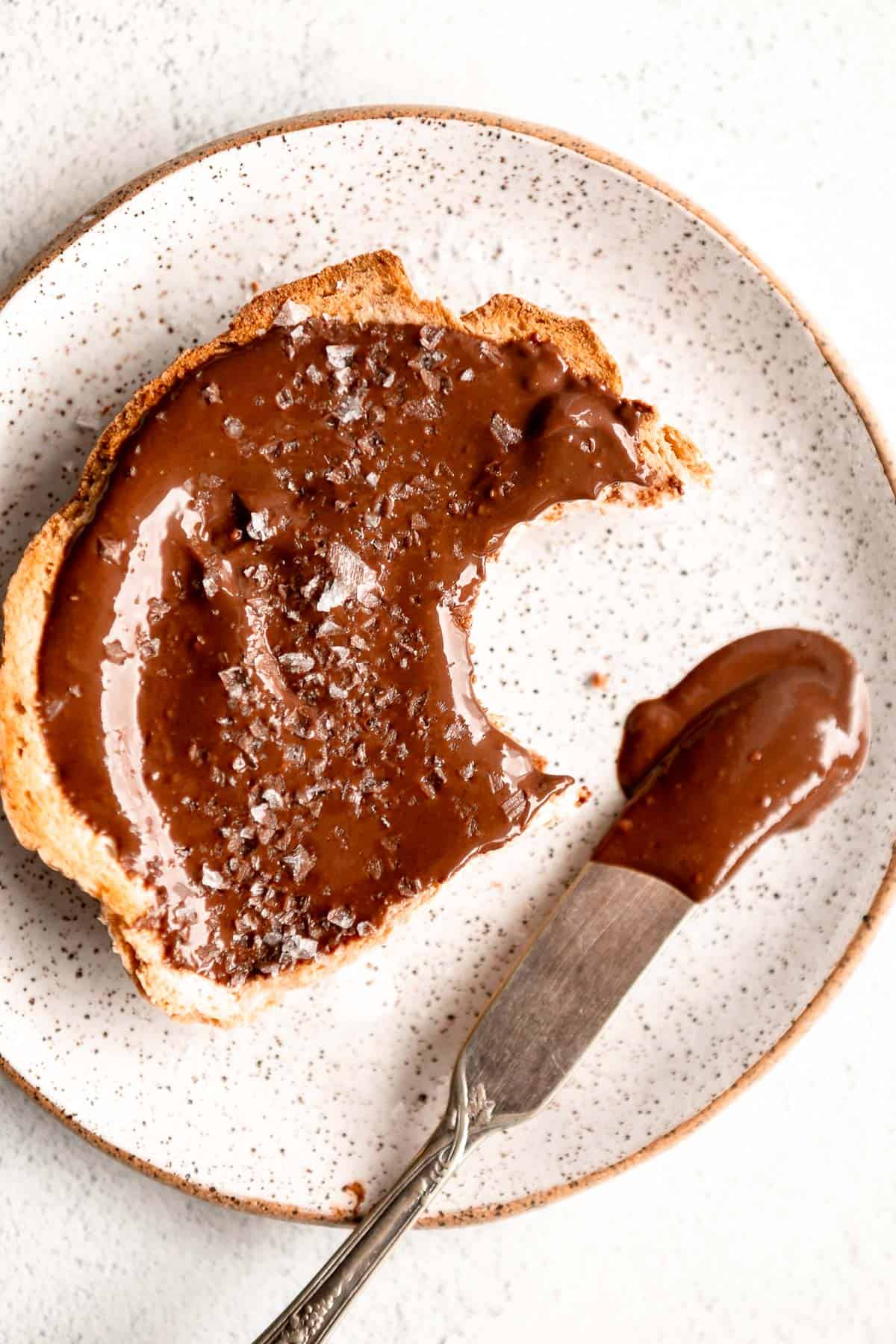 vegan nutella on a piece of toast with a knife