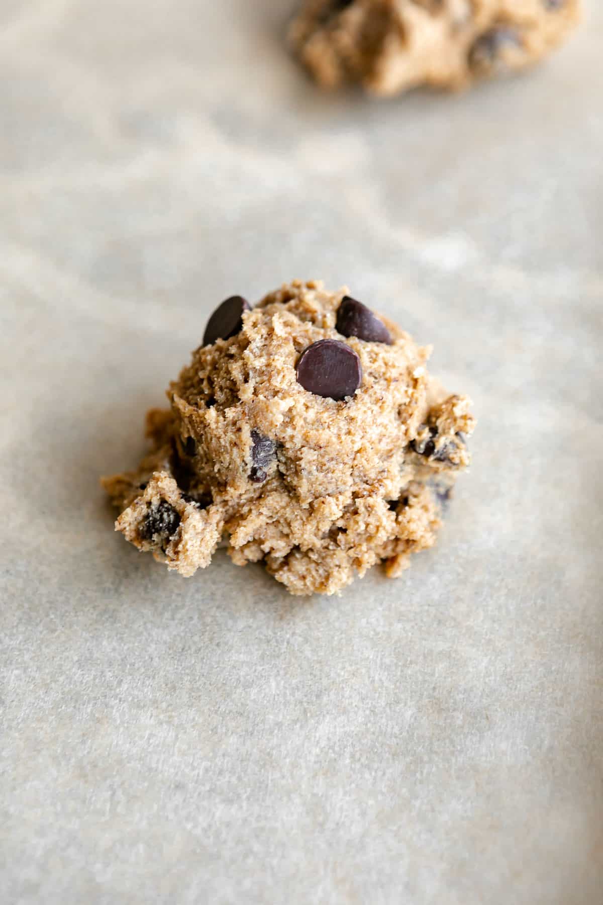 scoop of coffee cookie dough with chocolate chips before baking