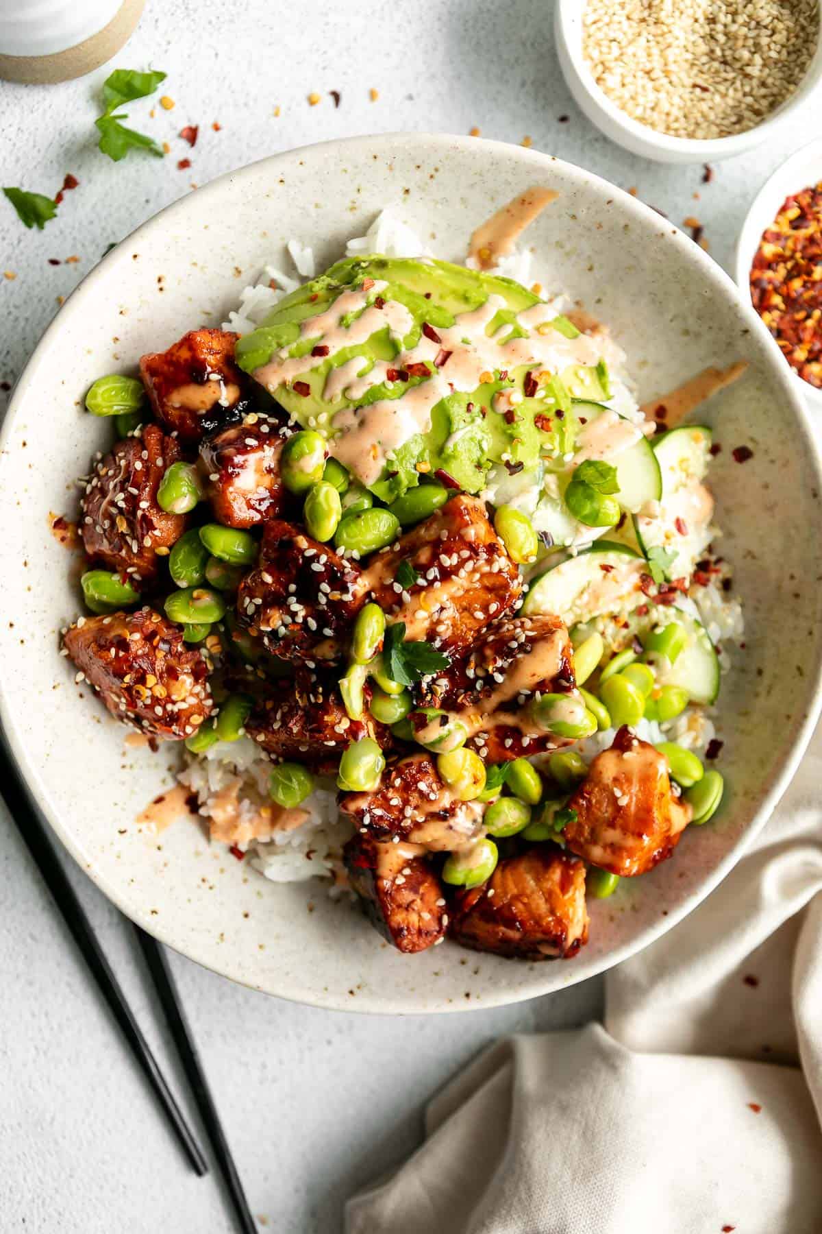 spicy sriracha salmon bowls with rice and cucumber