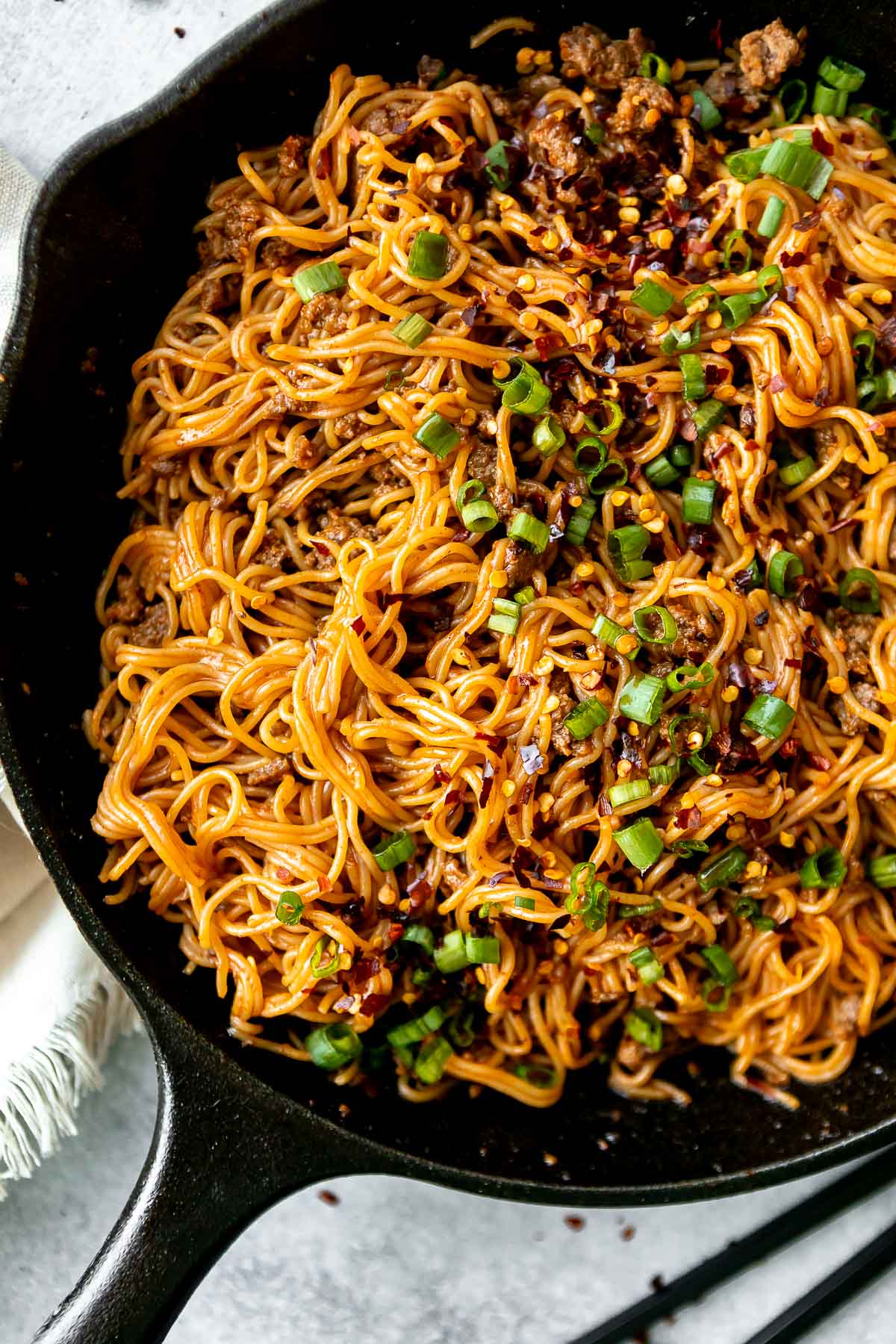 skillet with the noodles and scallions