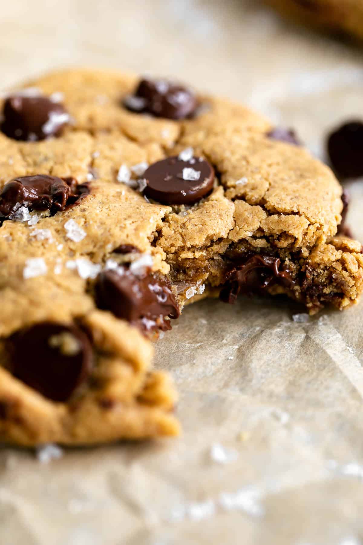 protein cookie with a bite taken out to show melted chocolate