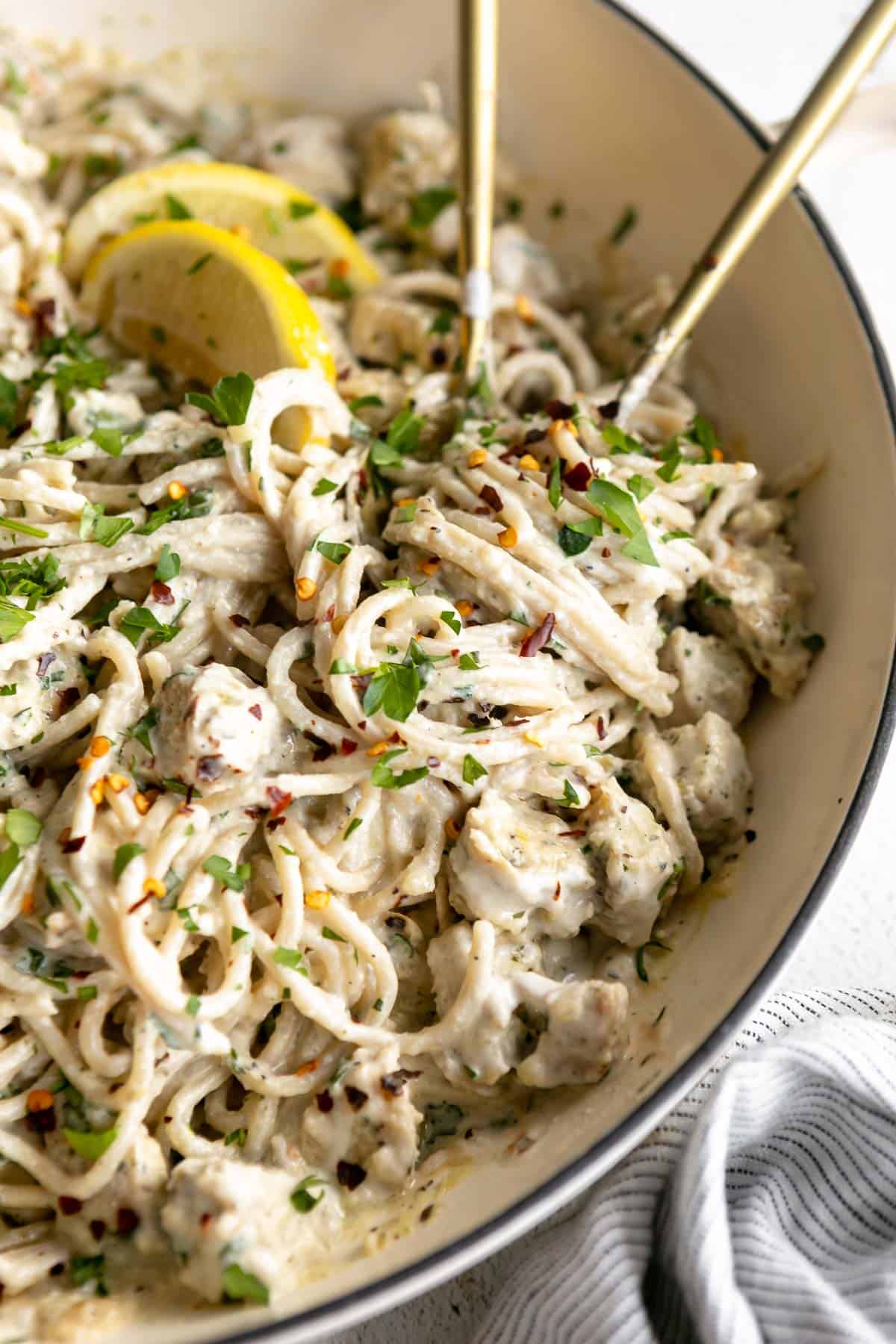 lemon chicken pasta with creamy parmesan sauce in a pan