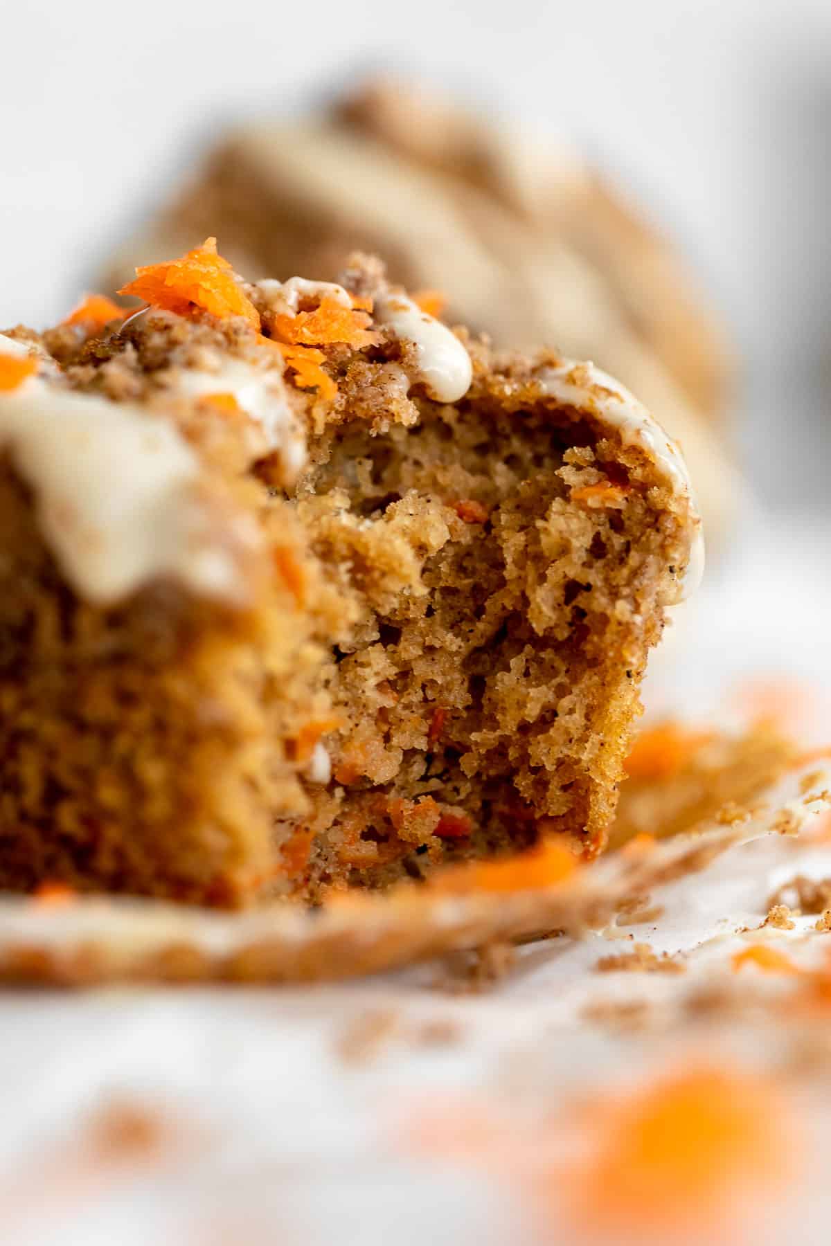 gluten free carrot cake muffins with a bite taken out 
