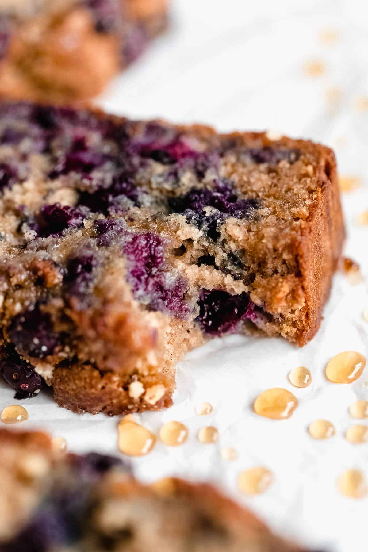 up close image of the blueberry banana bread with a bite taken out