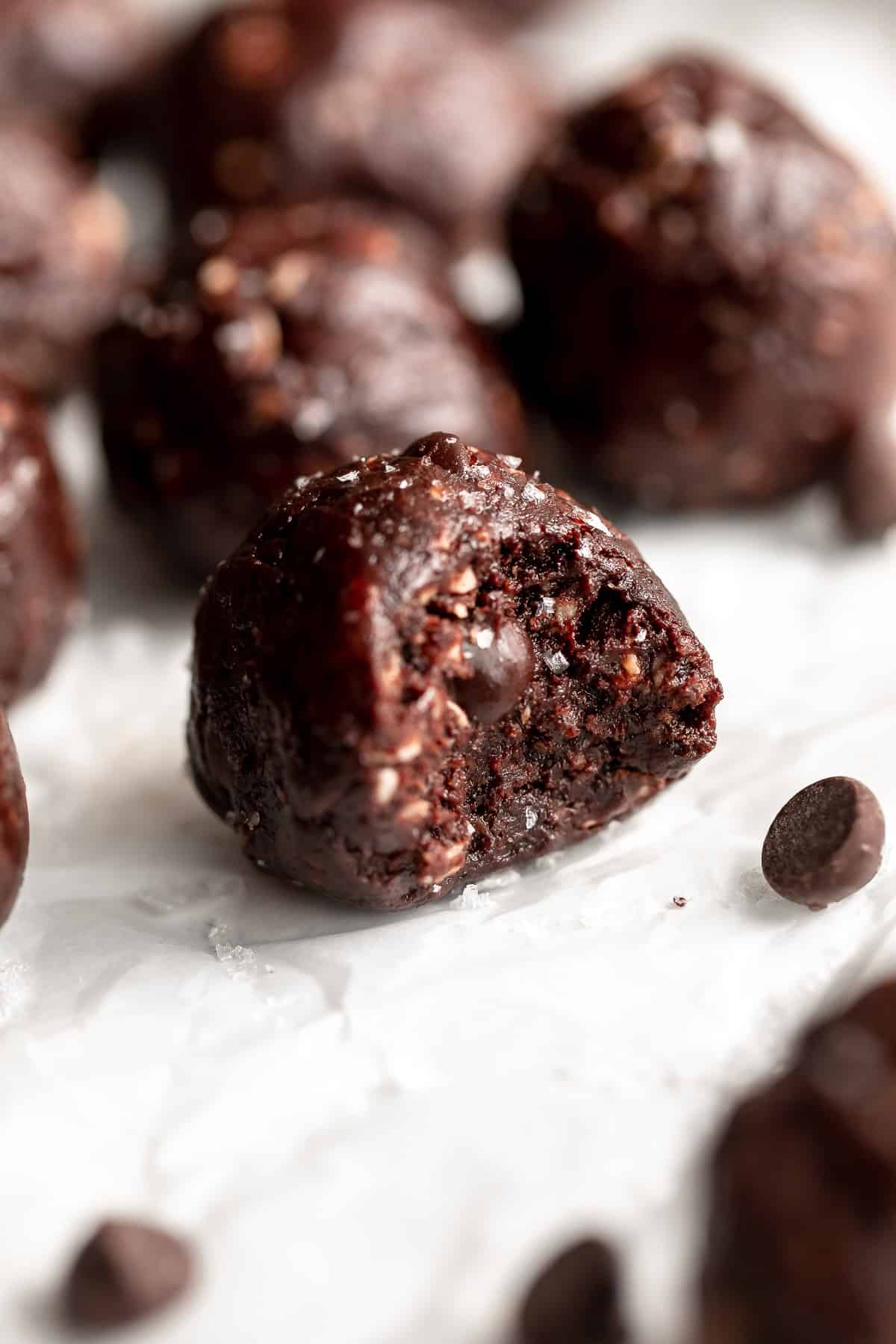 chocolate bliss balls with a bite taken out