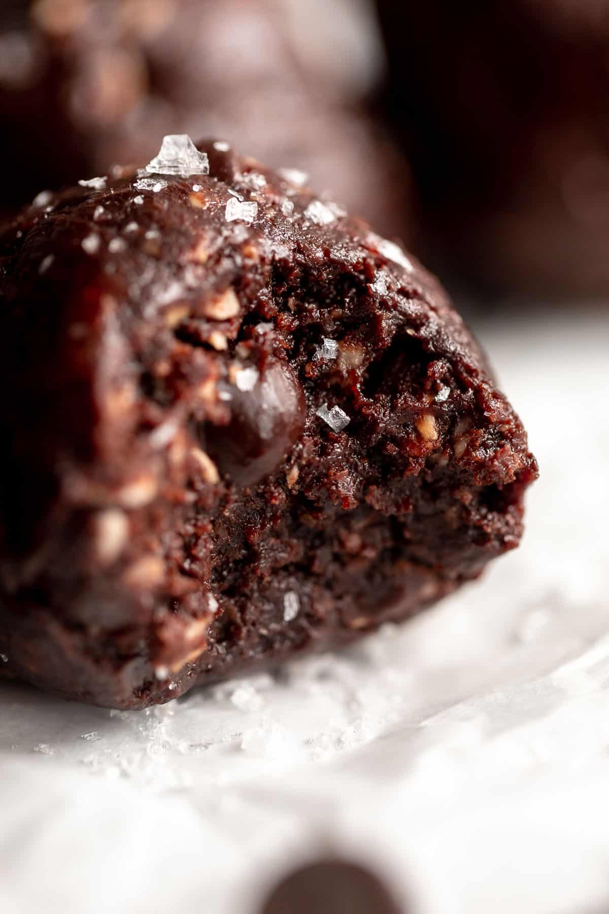 chocolate protein bliss balls with a bite taken out