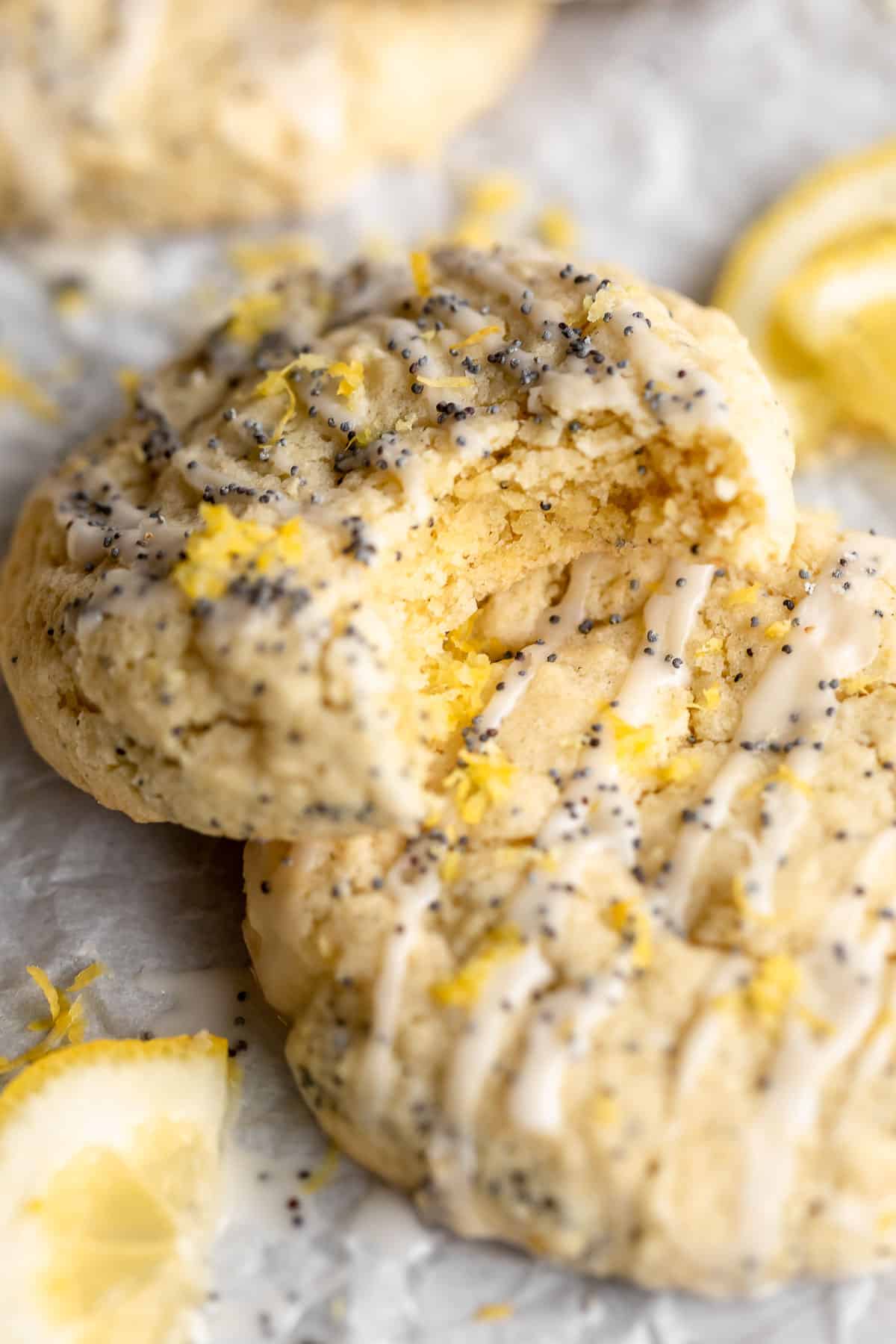 gluten free lemon poppy seed cookies with a bite taken out to show soft texture