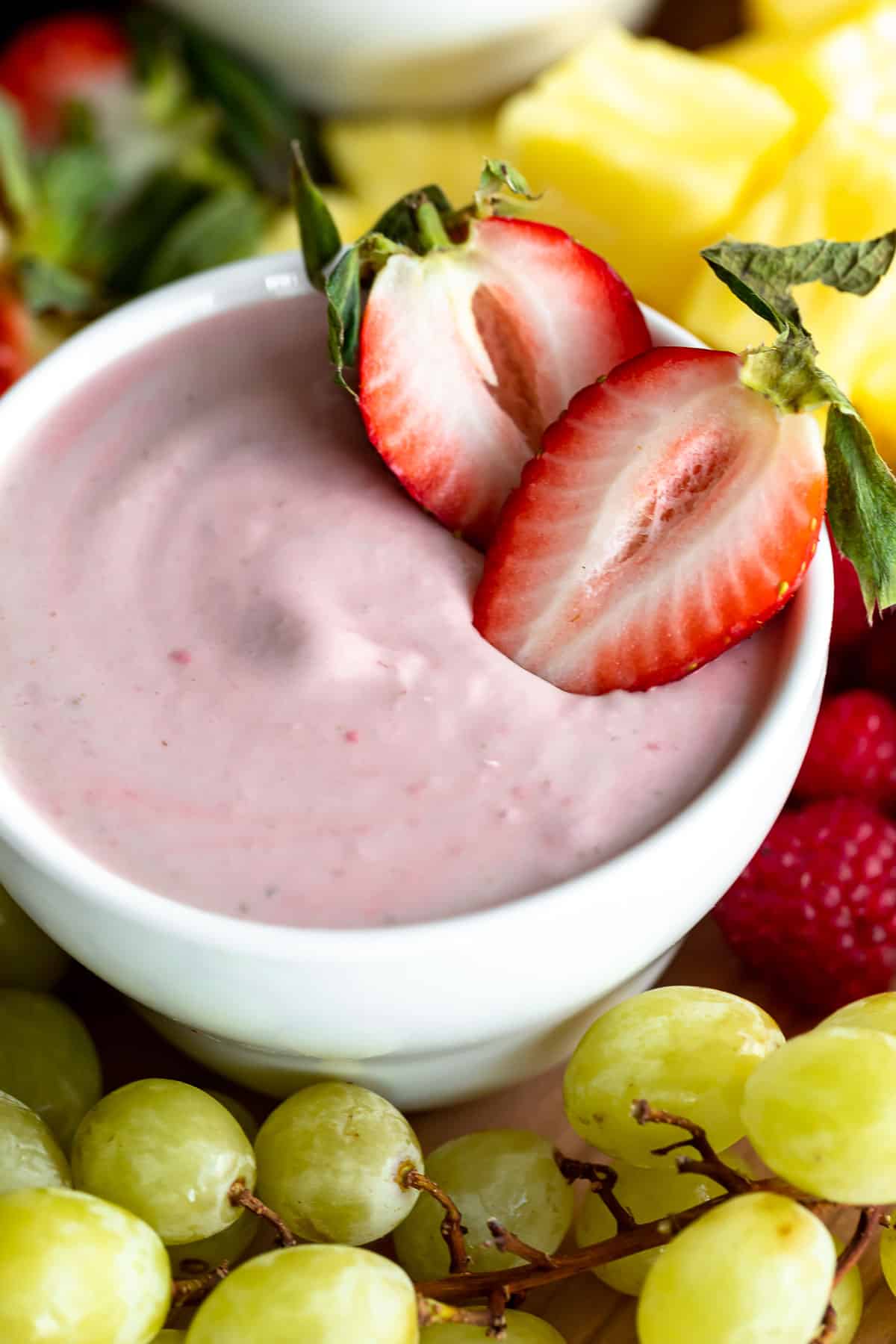 strawberry fruit dip in a bowl with berries on top