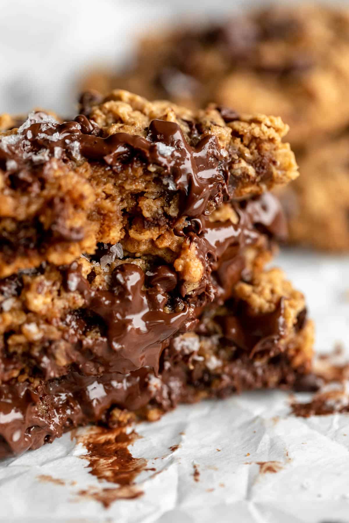 stack of vegan oatmeal cookies with melted chocolate
