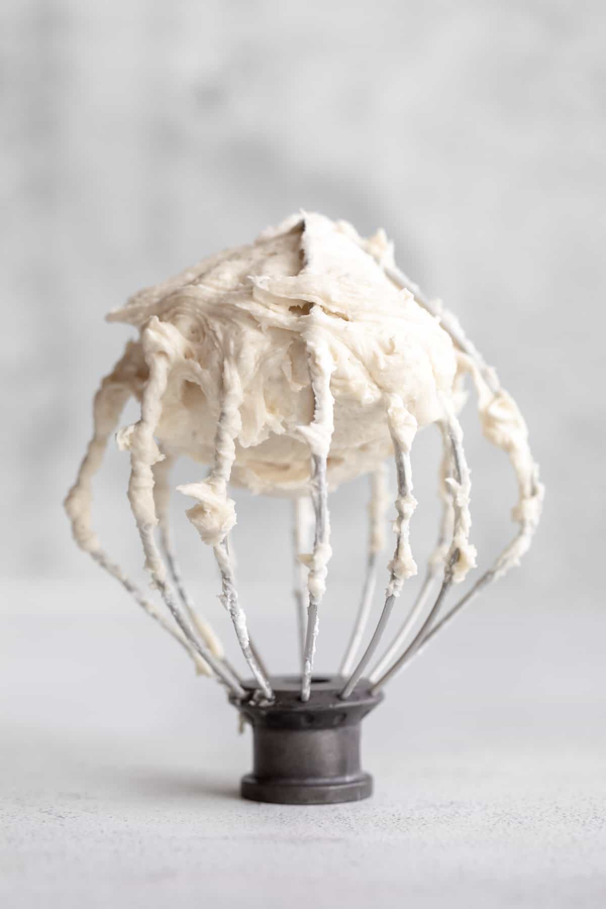 gluten free buttercream frosting whipped on a whisk