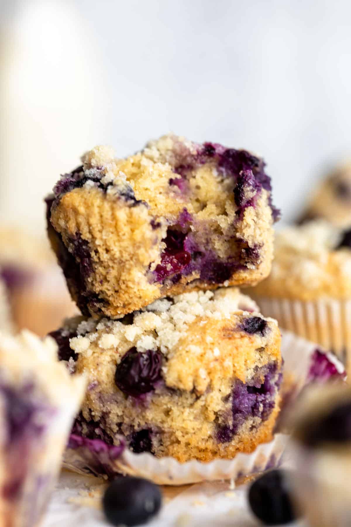 two almond flour blueberry muffins stacked on each other