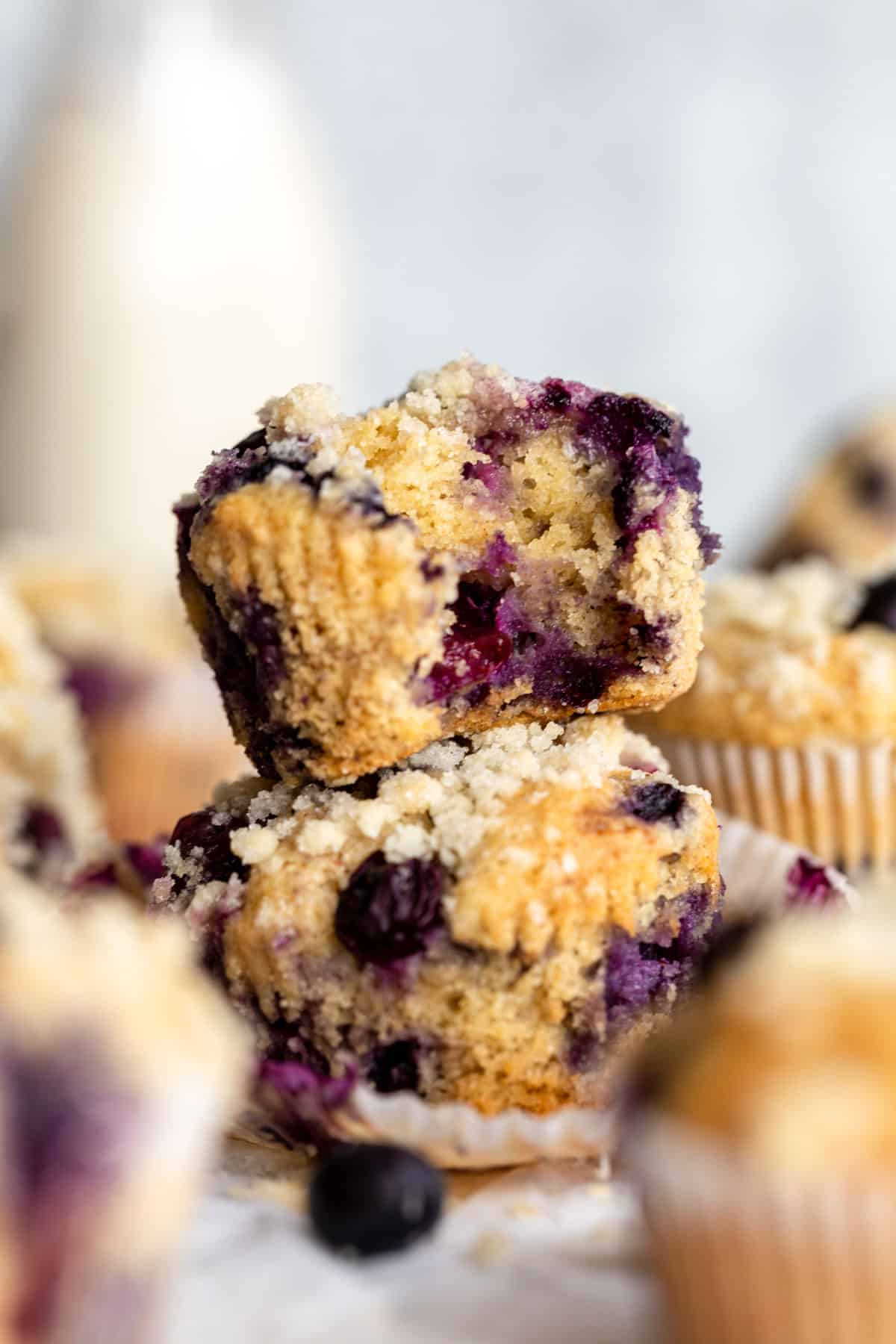 two almond flour blueberry muffins stacke on each other